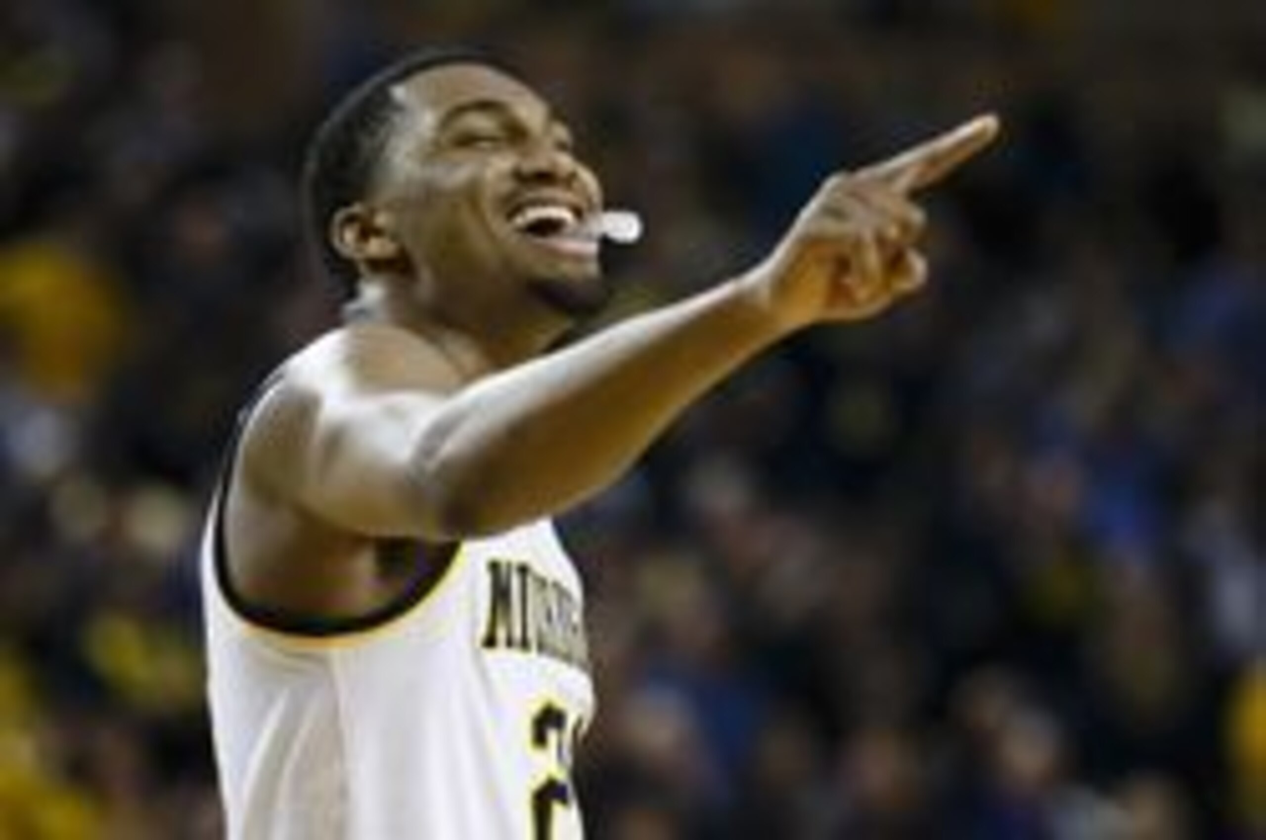 Feb 13, 2016; Ann Arbor, MI, USA; Michigan Wolverines guard Zak Irvin (21) celebrates during the second half against the Purdue Boilermakers at Crisler Center. Michigan won 61-56. Mandatory Credit: Rick Osentoski-USA TODAY Sports