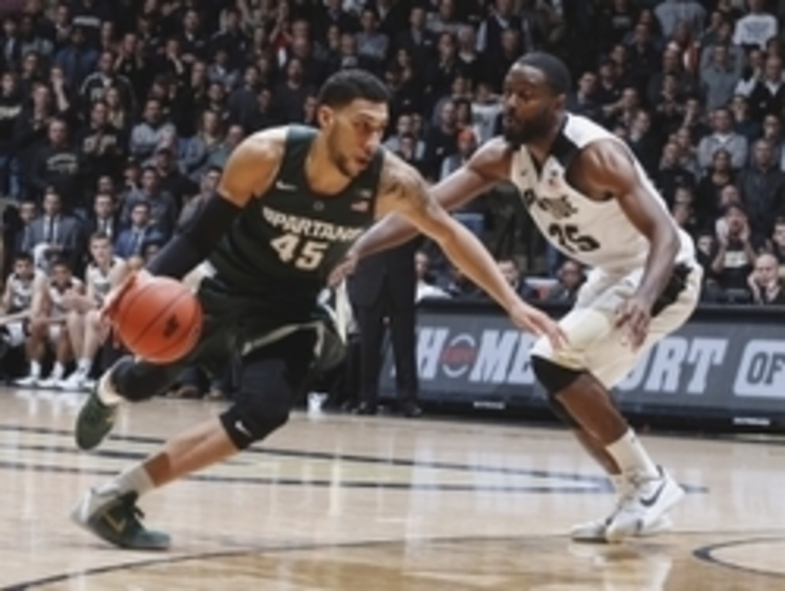 Feb 9, 2016; West Lafayette, IN, USA; Michigan State Spartans guard Denzel Valentine (45) drives to the basket against Purdue Boilermakers guard Rapheal Davis (35) at Mackey Arena. Purdue defeats Michigan State 82-81 in overtime. Mandatory Credit: Brian S