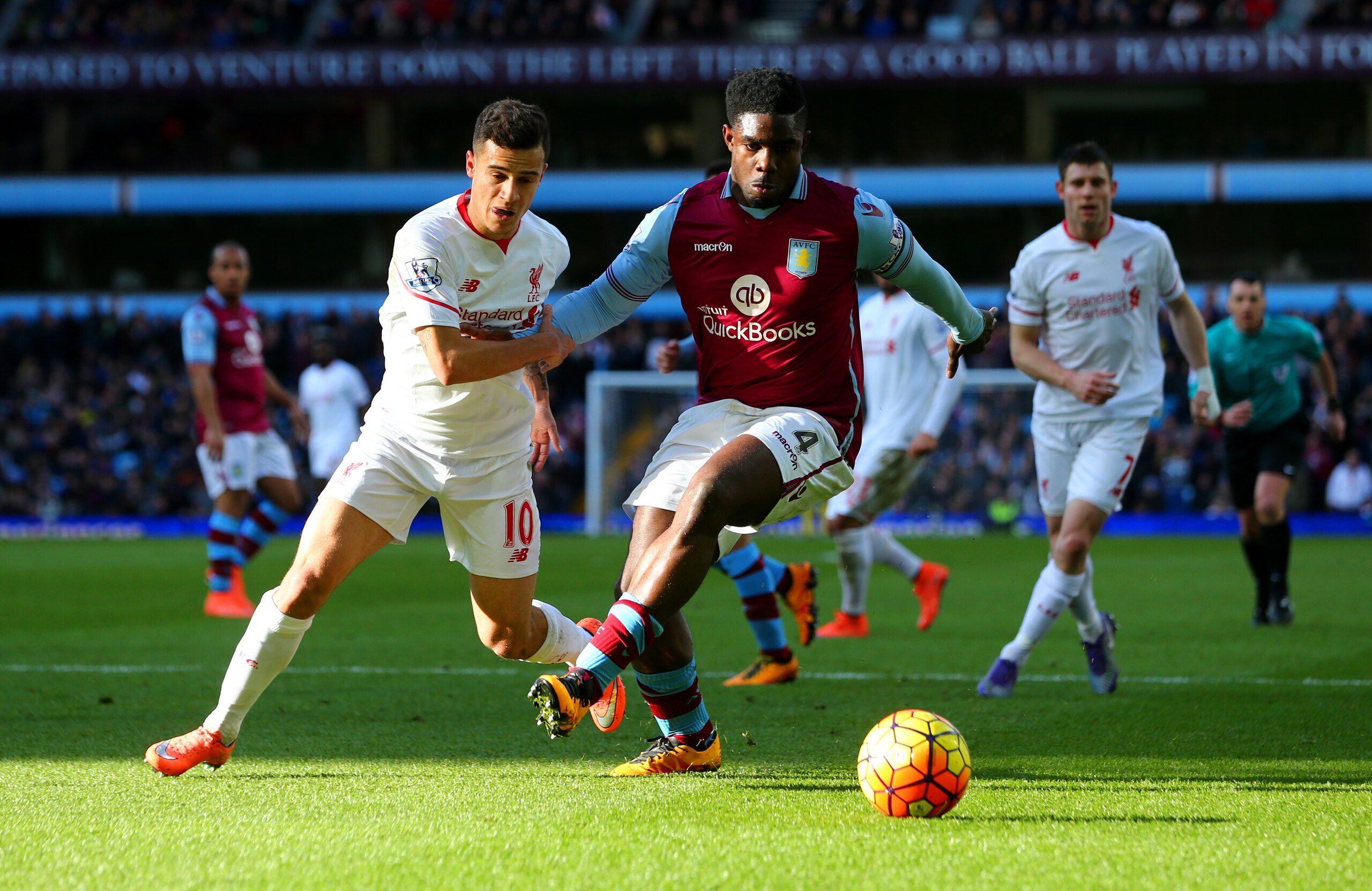 Philippe Coutinho and Micah Richards battle for possession.