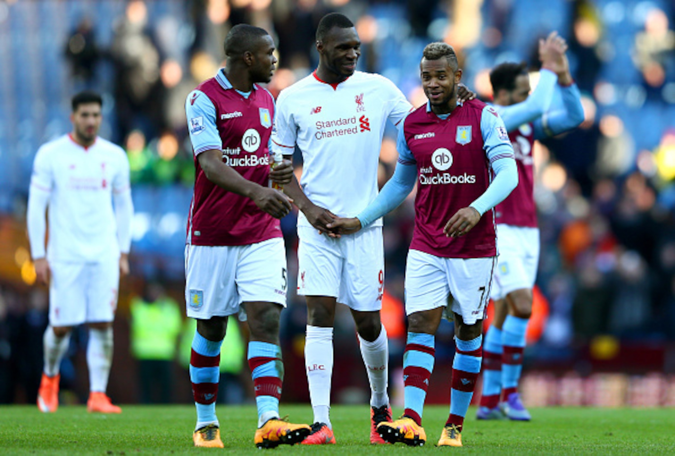 Christian Benteke talks to Aston Villa players after the final whistle.
