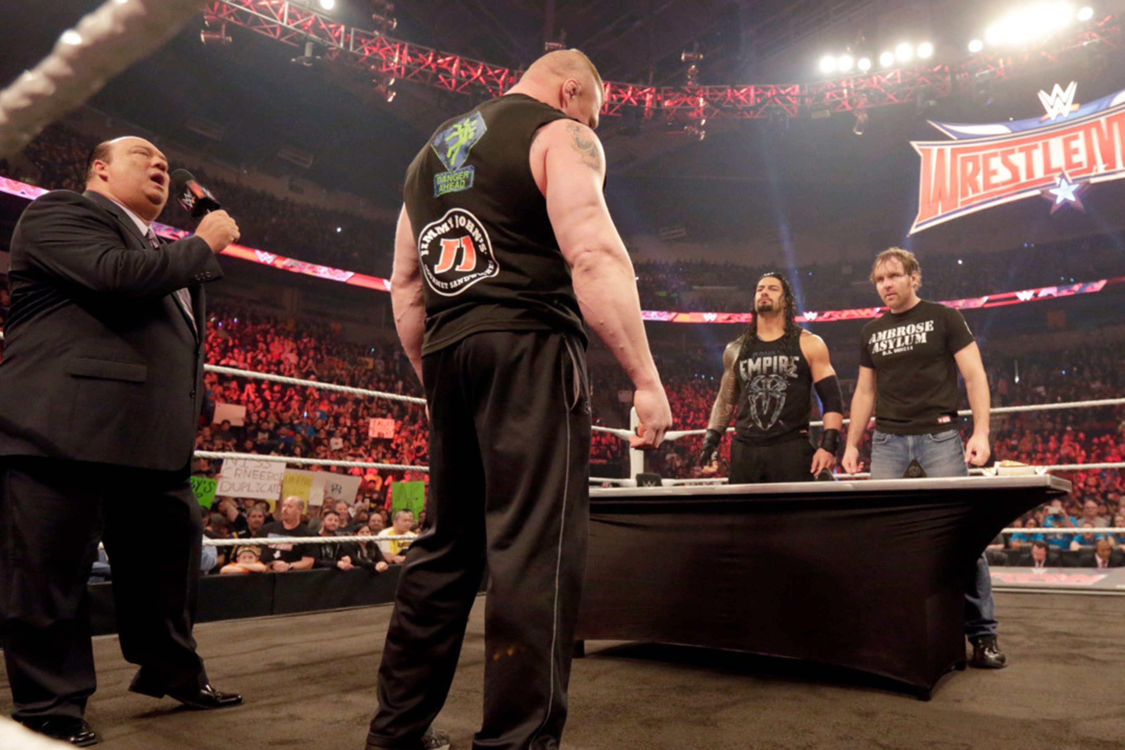 Brock Lesnar, Roman Reigns and Dean Ambrose sign their contract for WWE Fastlane Brock Lesnar, Roman Reigns and Dean Ambrose sign their contract for WWE Fastlane