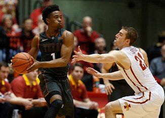 Texas guard Isaiah Taylor (left)