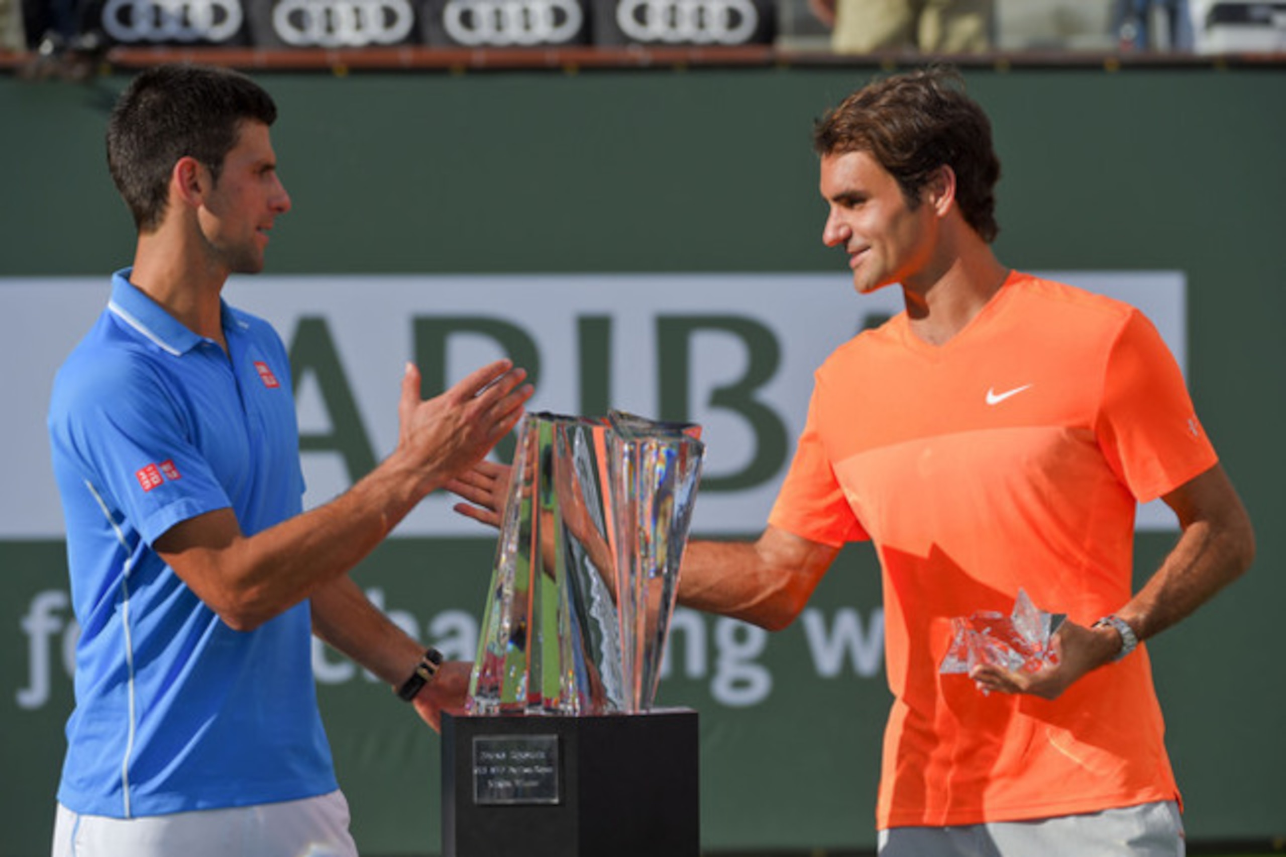 Novak Djokovic and Roger Federer shake hands during the trophy ceremony at the 2015 BNP Paribas Open