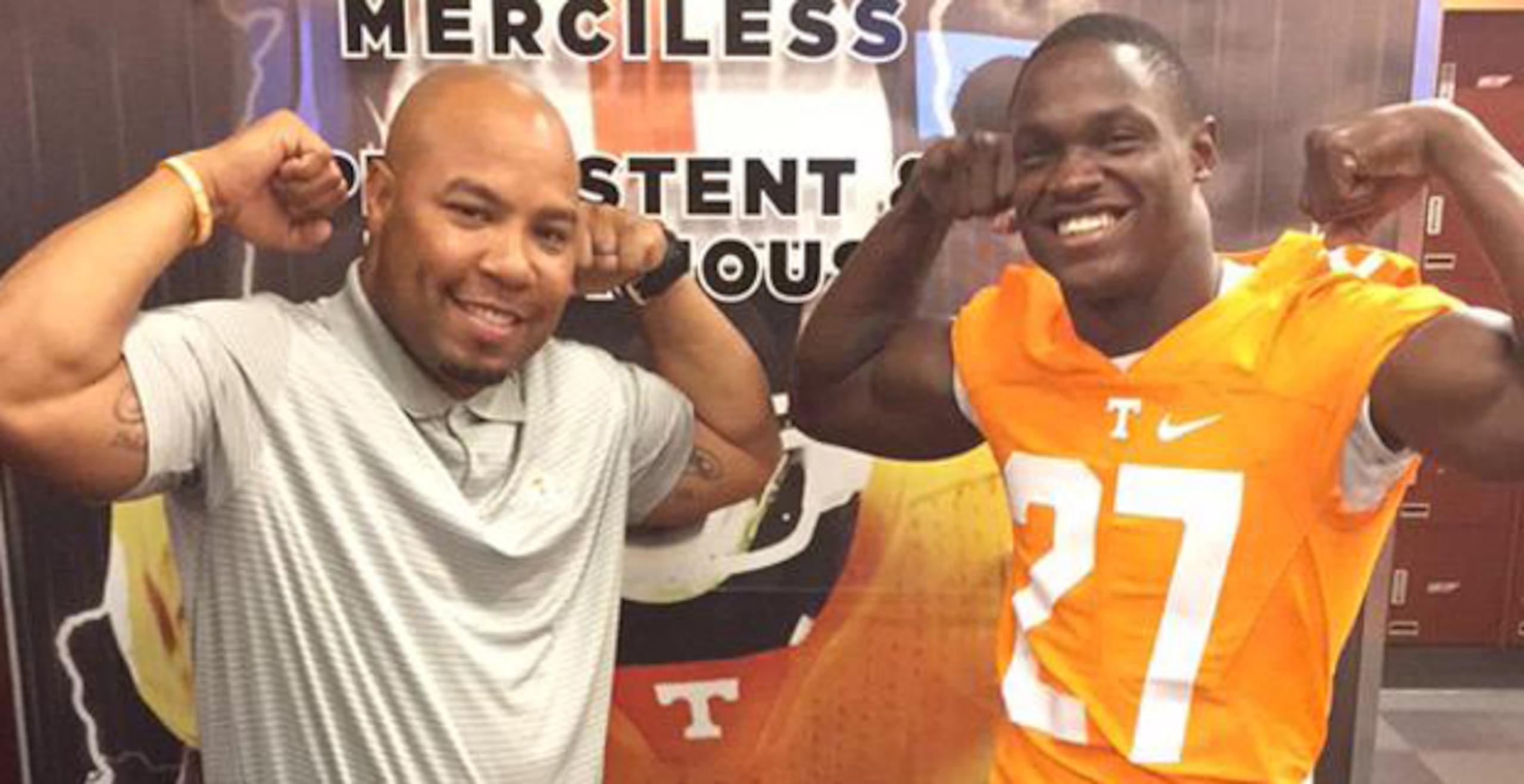 Carlin Fils-aime (right) poses with UT running backs coach Robert Gillespie.