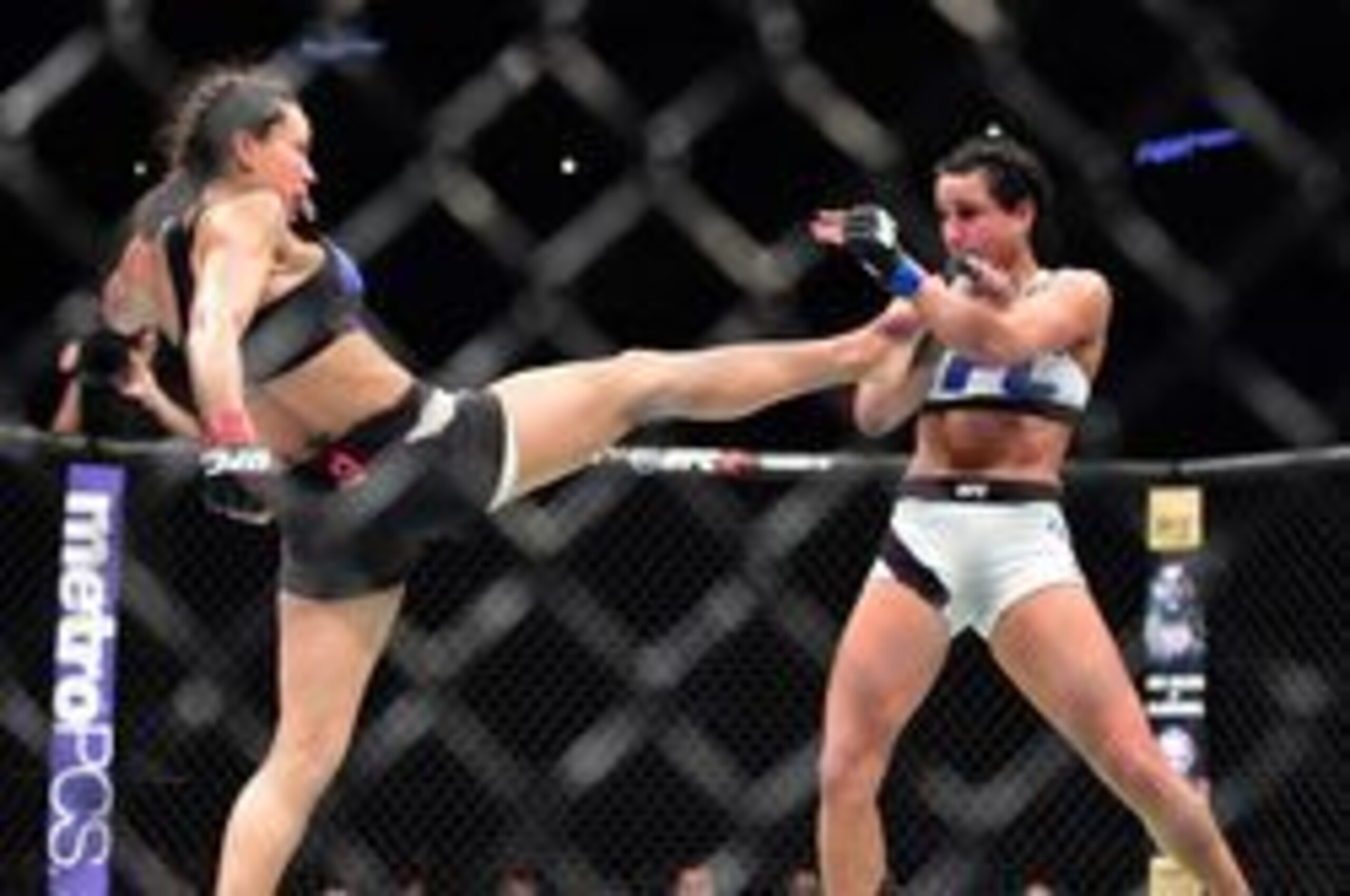Marion Reneau (left) kicks Ashlee Evans-Smith