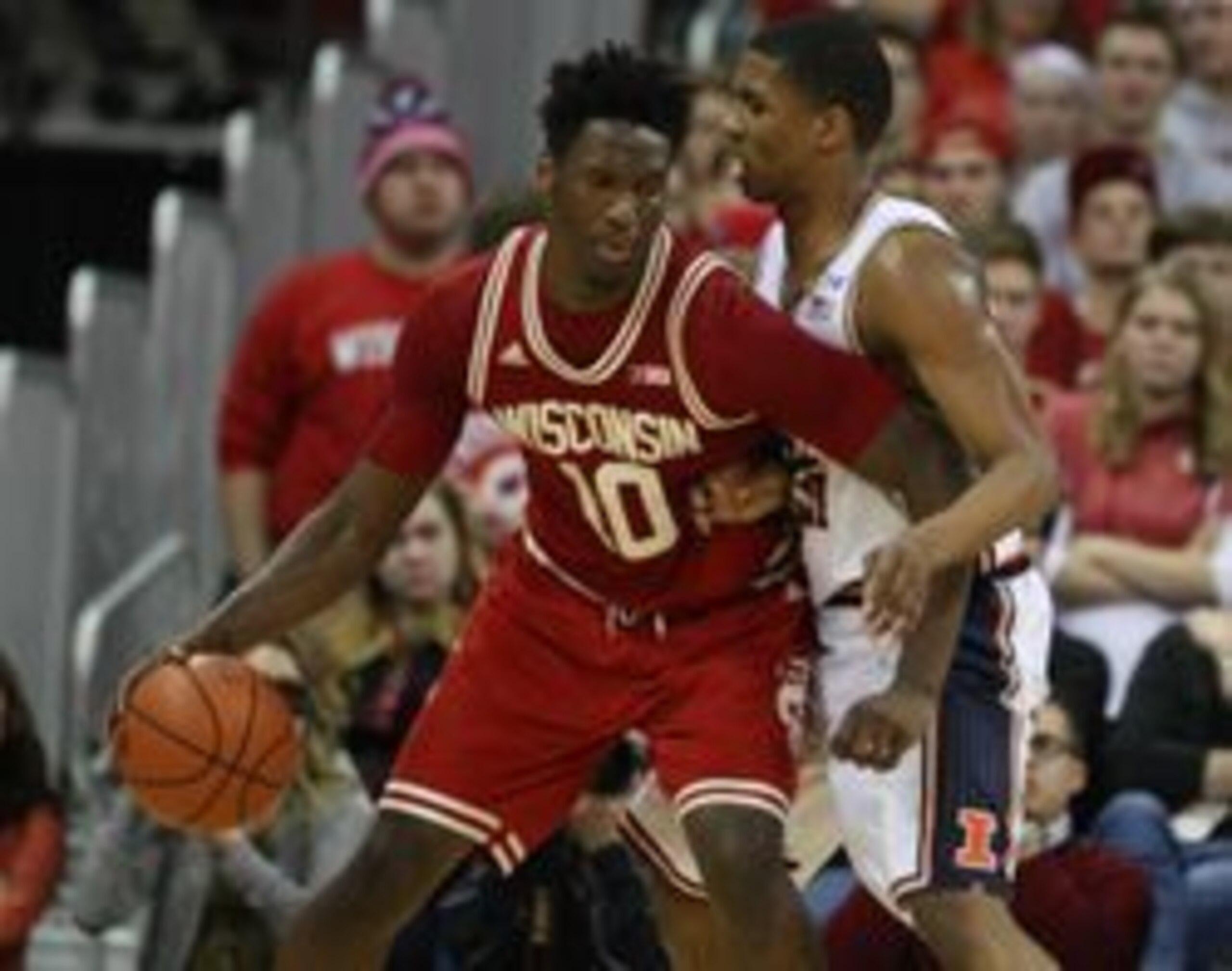 Feb 21, 2016; Madison, WI, USA; Wisconsin Badgers forward Nigel Hayes (10) moves the ball past Illinois Fighting Illini guard Malcolm Hill (right) during the game at the Kohl Center.  Wisconsin defeated Illinois 69-60.  Mandatory Credit: Mary Langenfeld-U