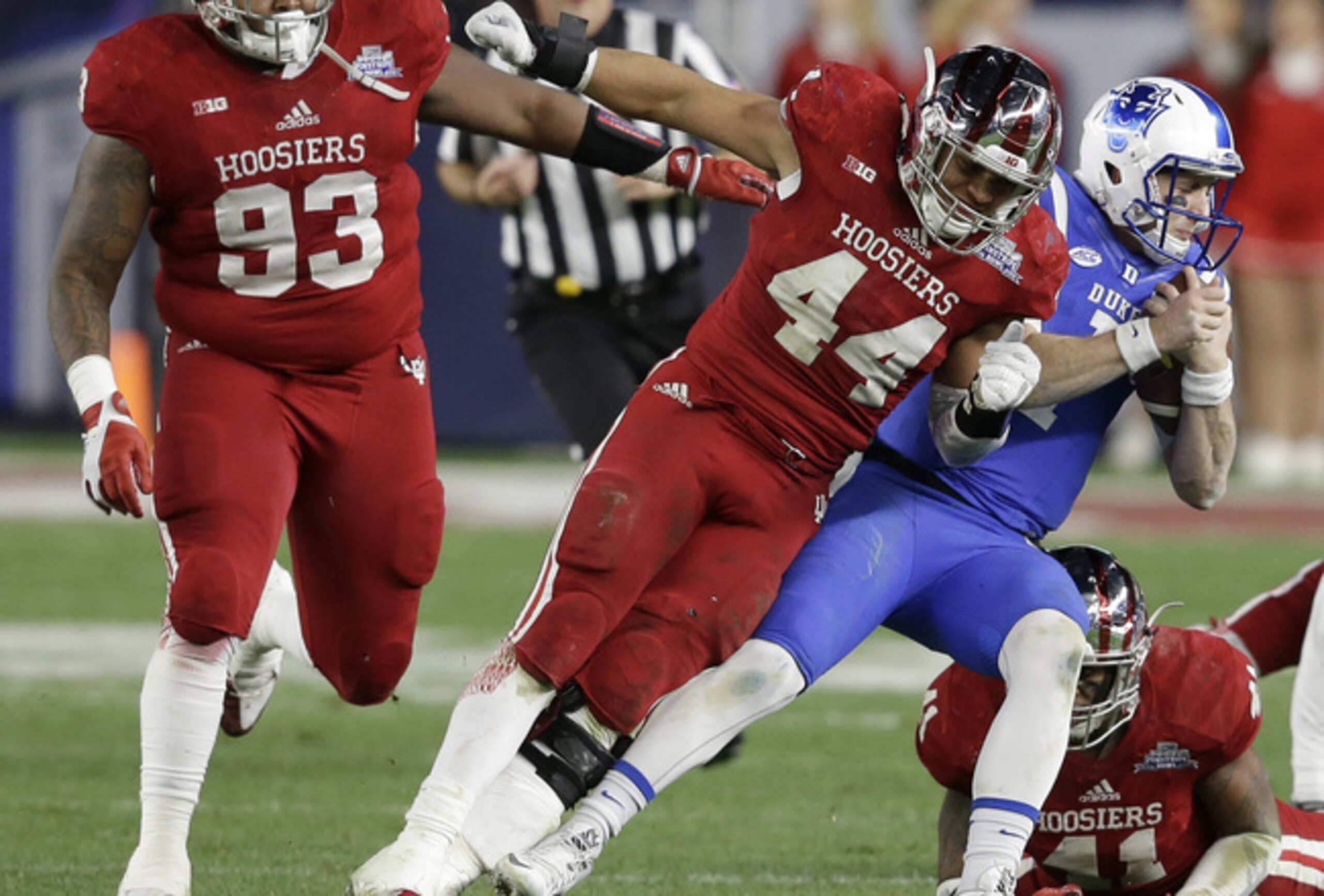 Indiana LB Marcus Oliver (center)