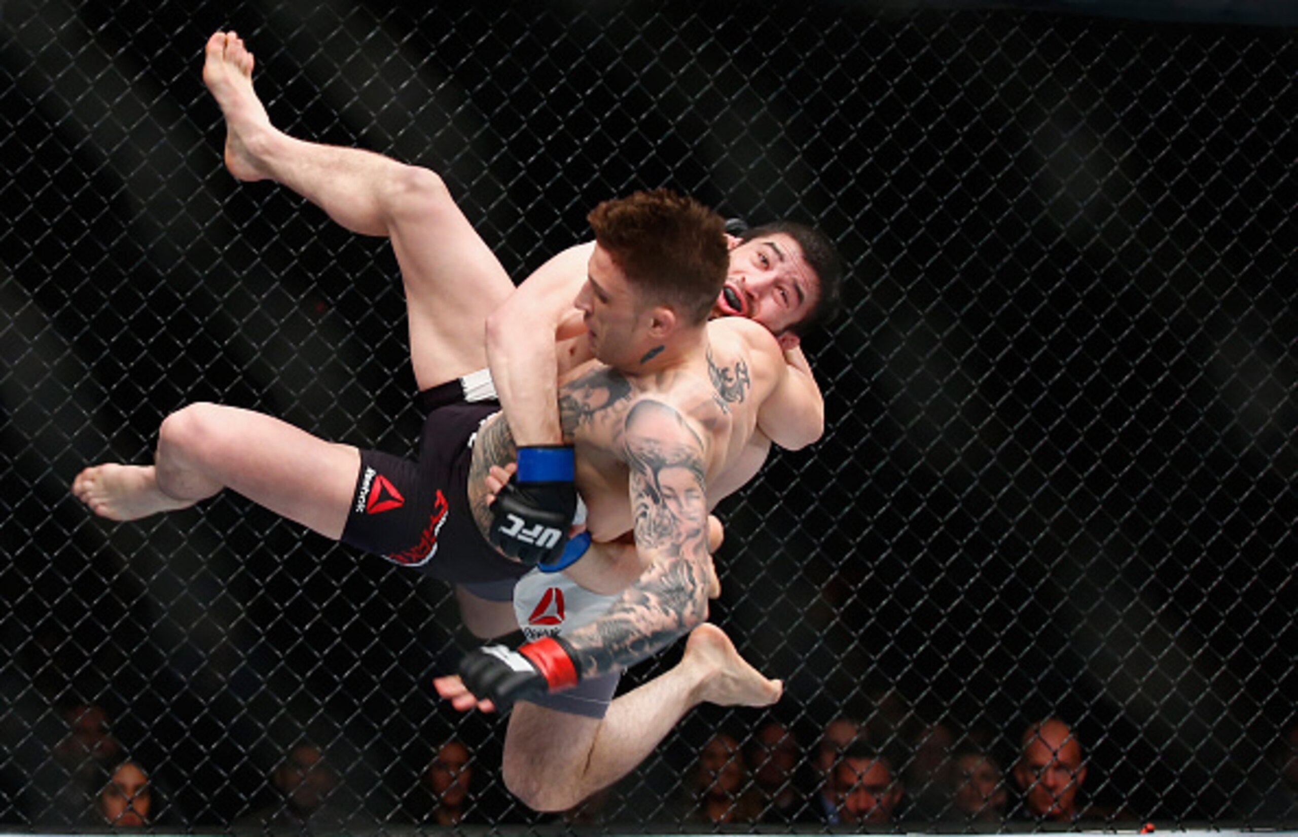 LONDON, ENGLAND - FEBRUARY 27:  Rustam Khabilov of Russia (Black Shoirts) throws Norman Parke of Nortern Ireland during the Middleweight Bout of the UFC Fight Night  at The O2 Arena on February 27, 2016 in London, England.  (Photo by Christopher Lee/Getty
