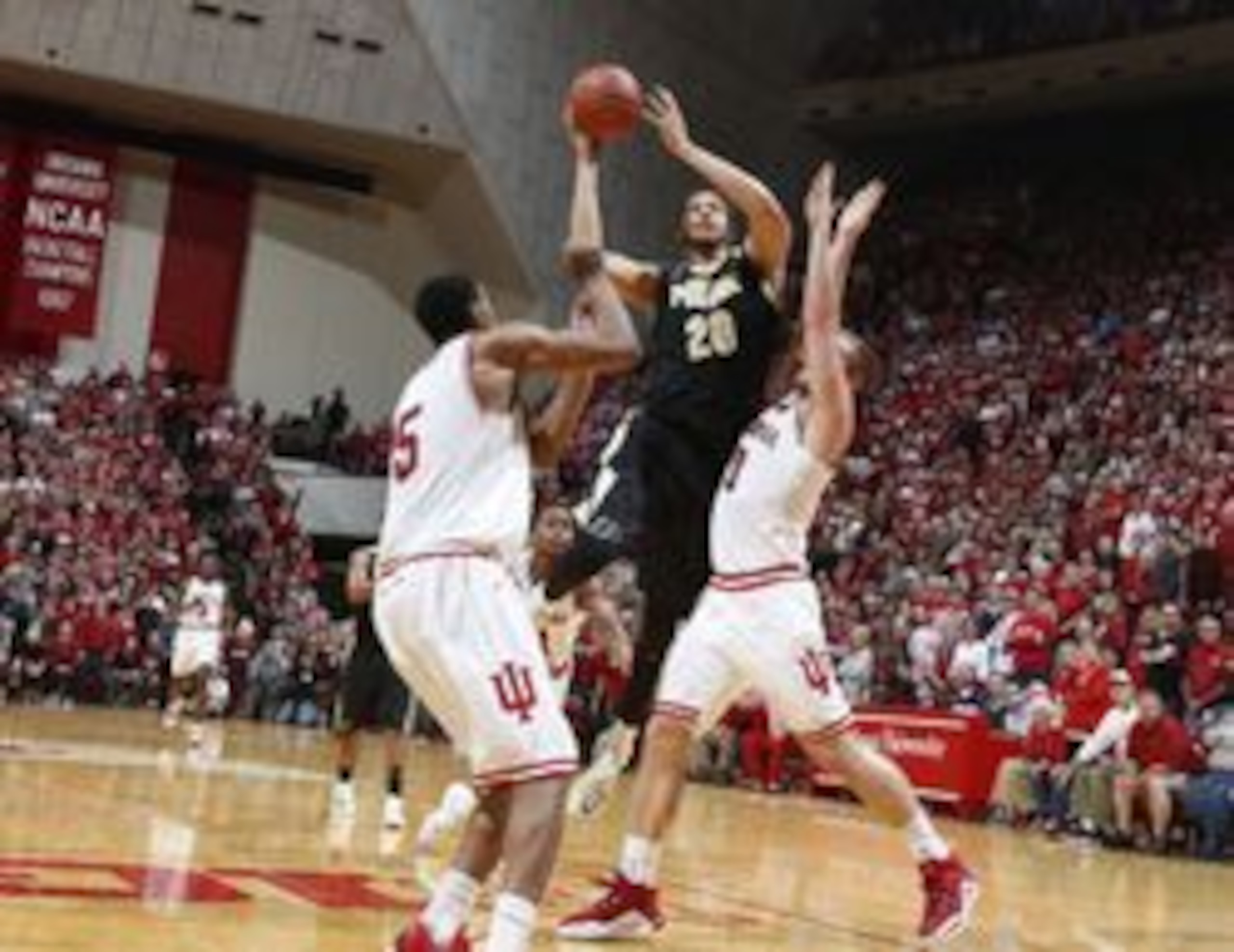 Feb 20, 2016; Bloomington, IN, USA; Purdue Boilermakers center A.J. Hammons (20) shoots against Indiana Hoosiers forward Max Bielfeldt (0) at Assembly Hall. Indiana defeats Purdue 77-73. Mandatory Credit: Brian Spurlock-USA TODAY Sports