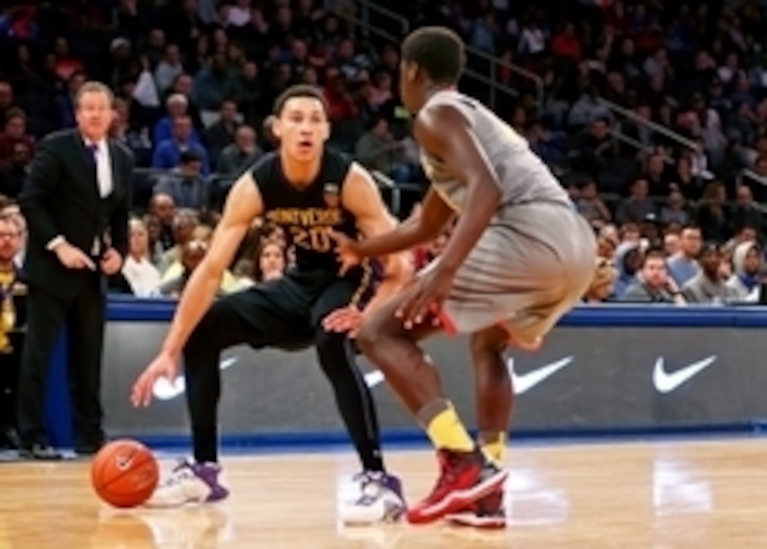 Apr 4, 2015; New York, NY, USA; Oak Hill Academy forward Khadim Sy (31) defends as Montverde Academy  guard/forward Ben Simmons (20)  plays the ball during the second half during the Dick's Sporting Goods High School Nationals boys final game at at Madiso