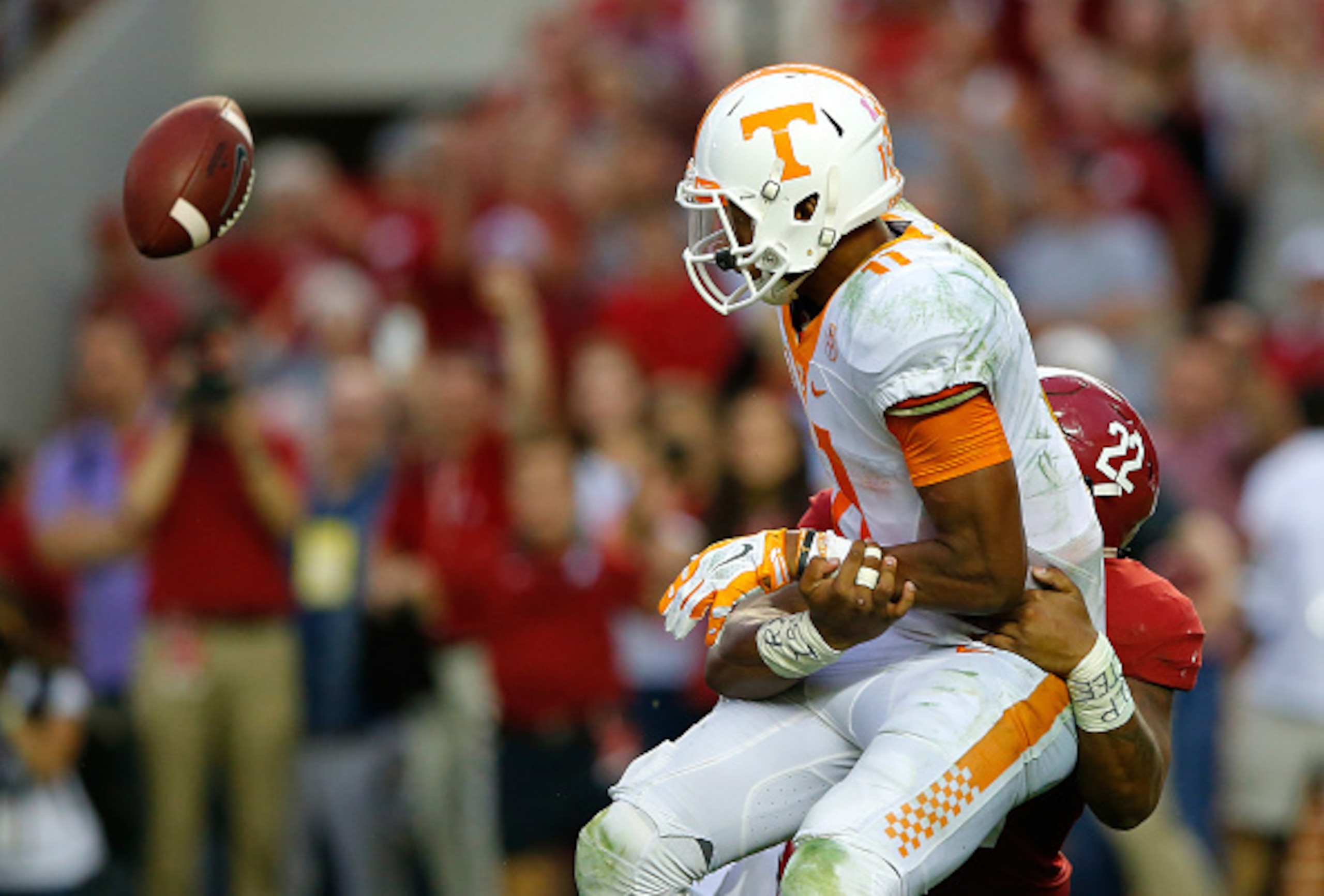 Tennessee QB Joshua Dobbs (left) and Alabama LB Ryan Anderson (right)