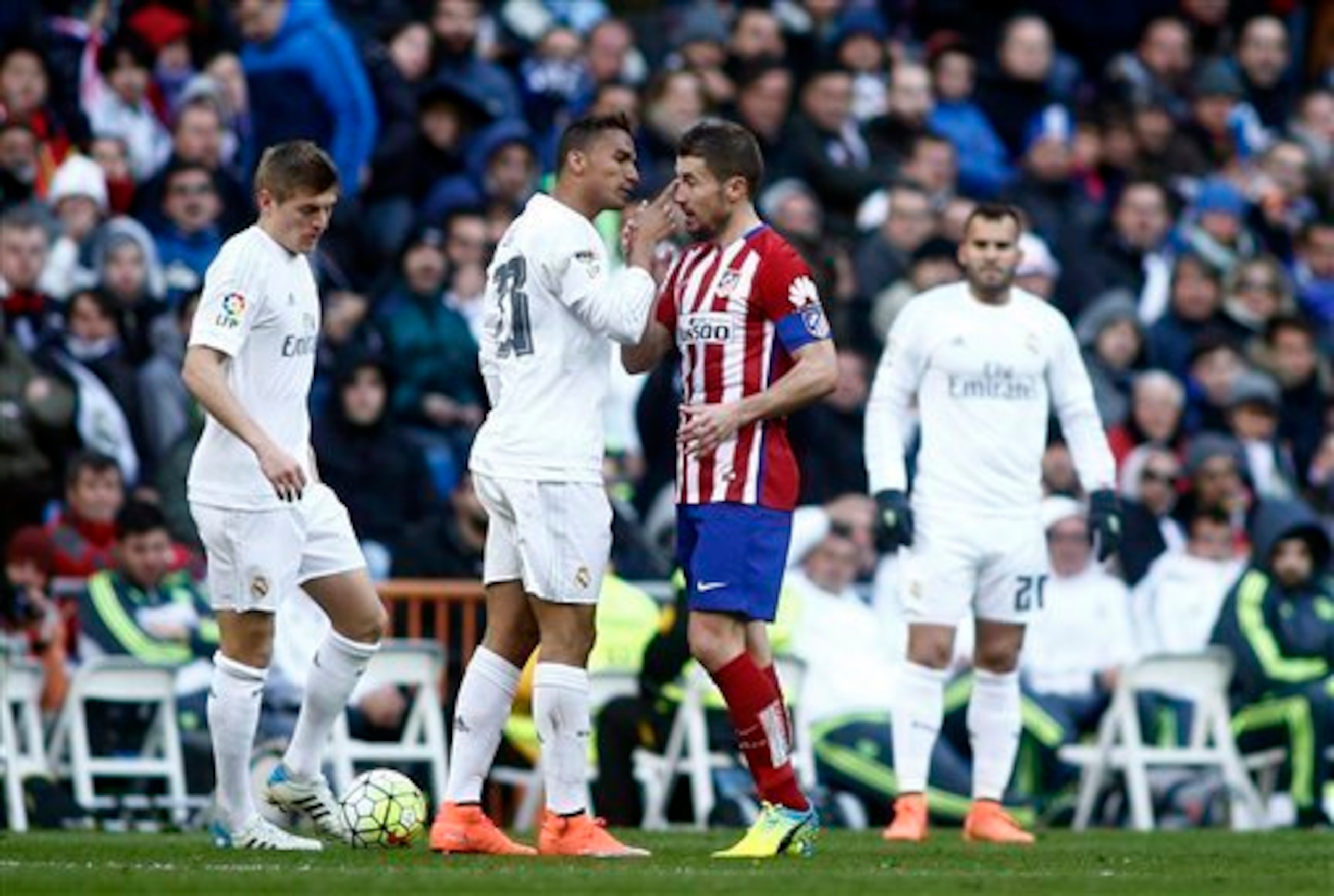 Real Madrid's Danilo, left, reacts against Atletico’s Gabi during a Spanish La Liga soccer match between Real Madrid and Atletico Madrid at the Santiago Bernabeu stadium in Madrid, Spain, Saturday Feb. 27, 2016. (AP Photo/Oscar del Pozo)