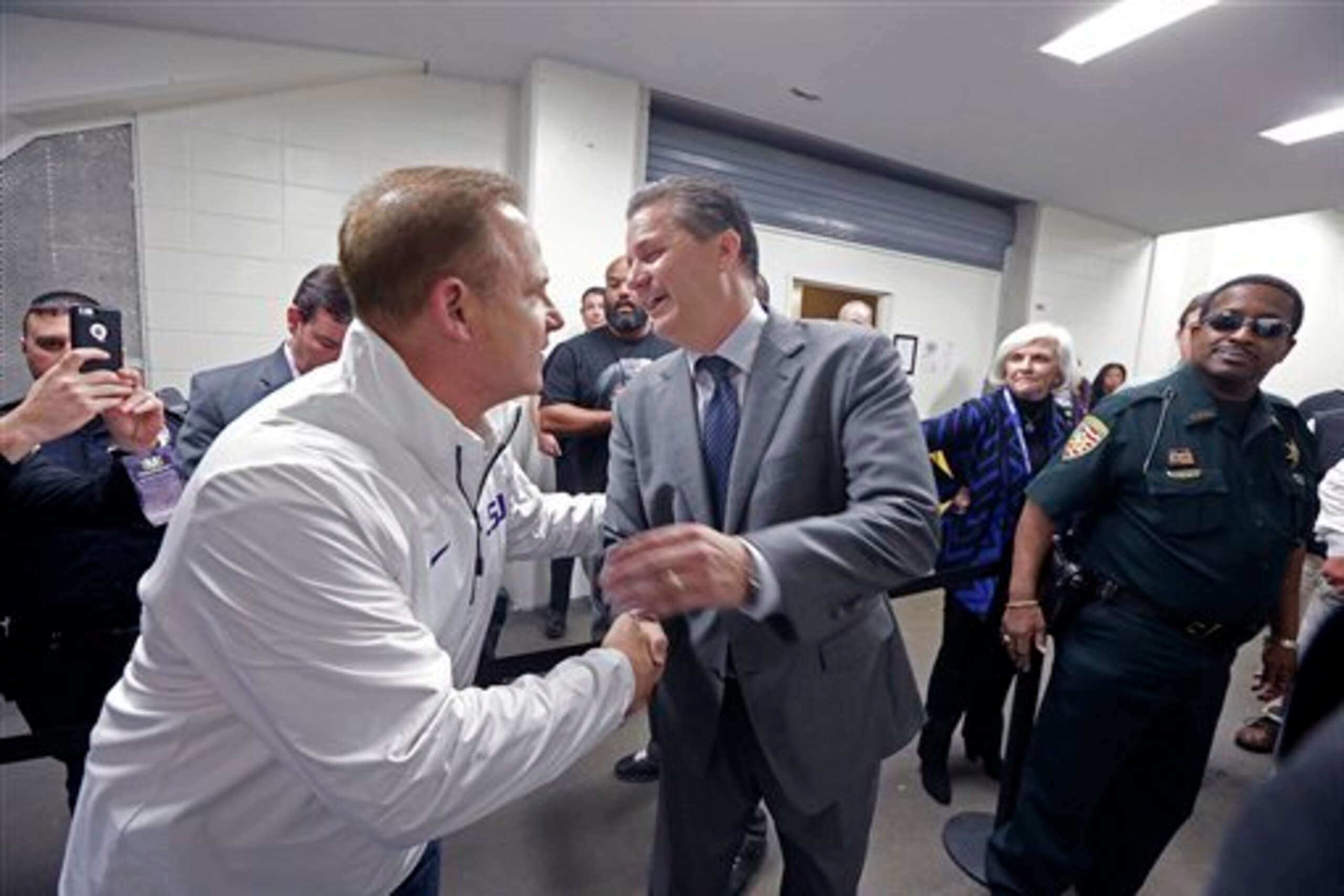 LSU football coach Les Miles would probably give Kentucky's John Calipari a run for his money on the college basketball recruiting trail.