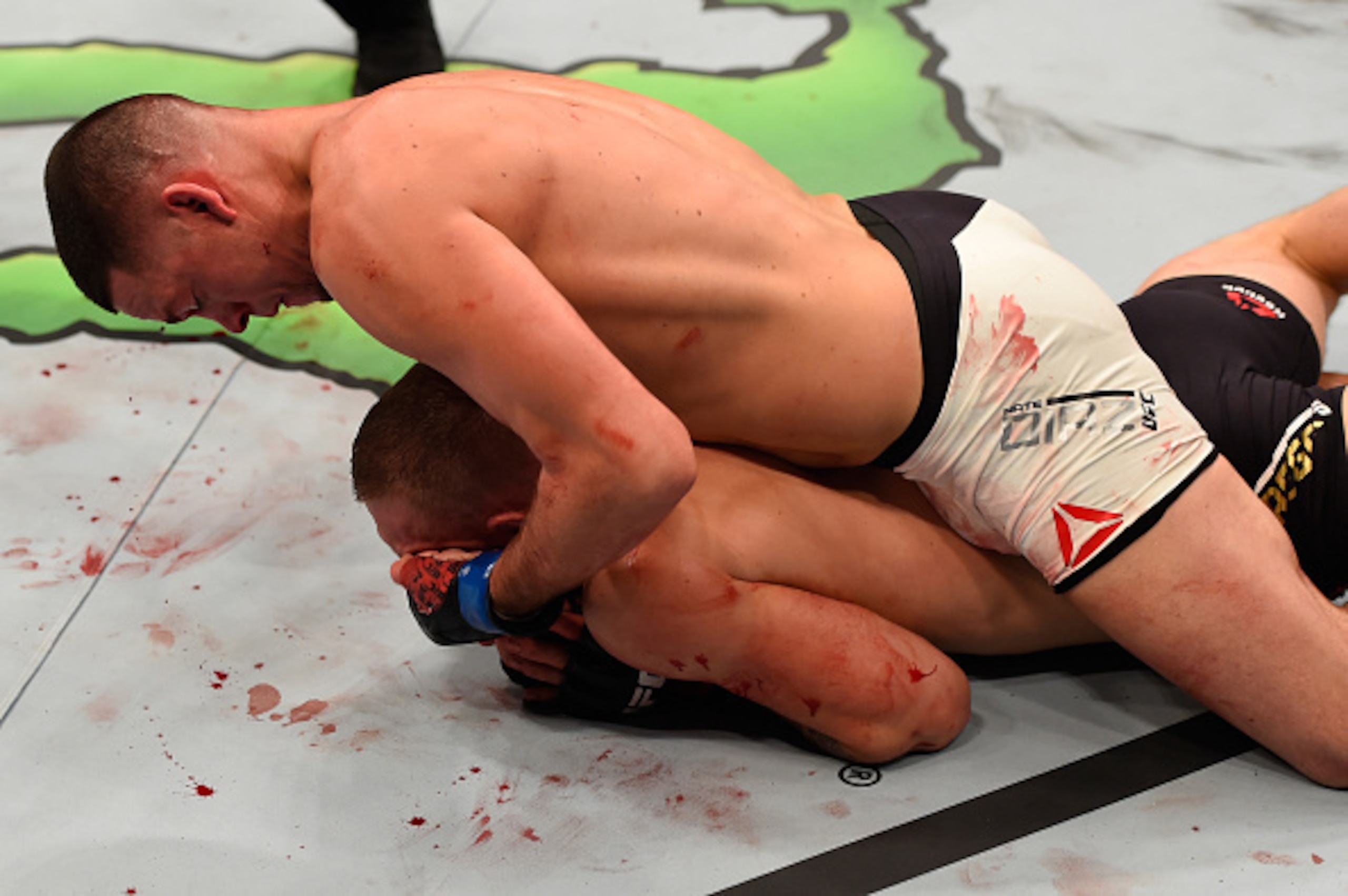 McGregor (bottom) in the rear-naked choke that ended the fight.