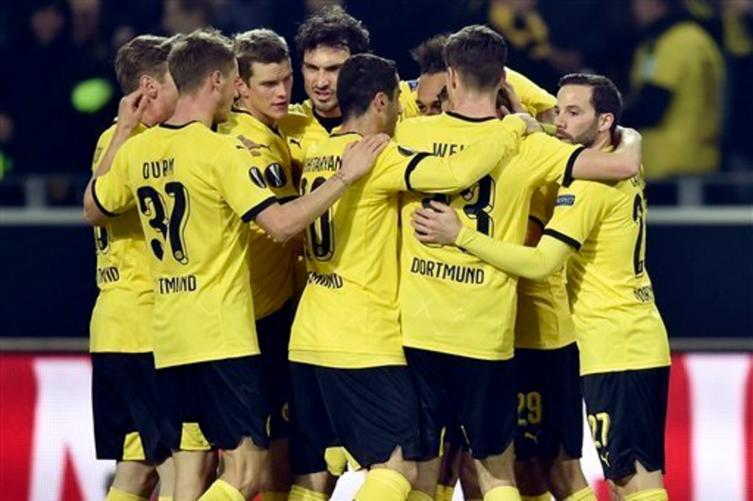 Borussia Dortmund celebrate Pierre-Emerick Aubameyang's opener on their way to securing a first-leg round-of-16 Europa League win over Tottenham Hotspur.