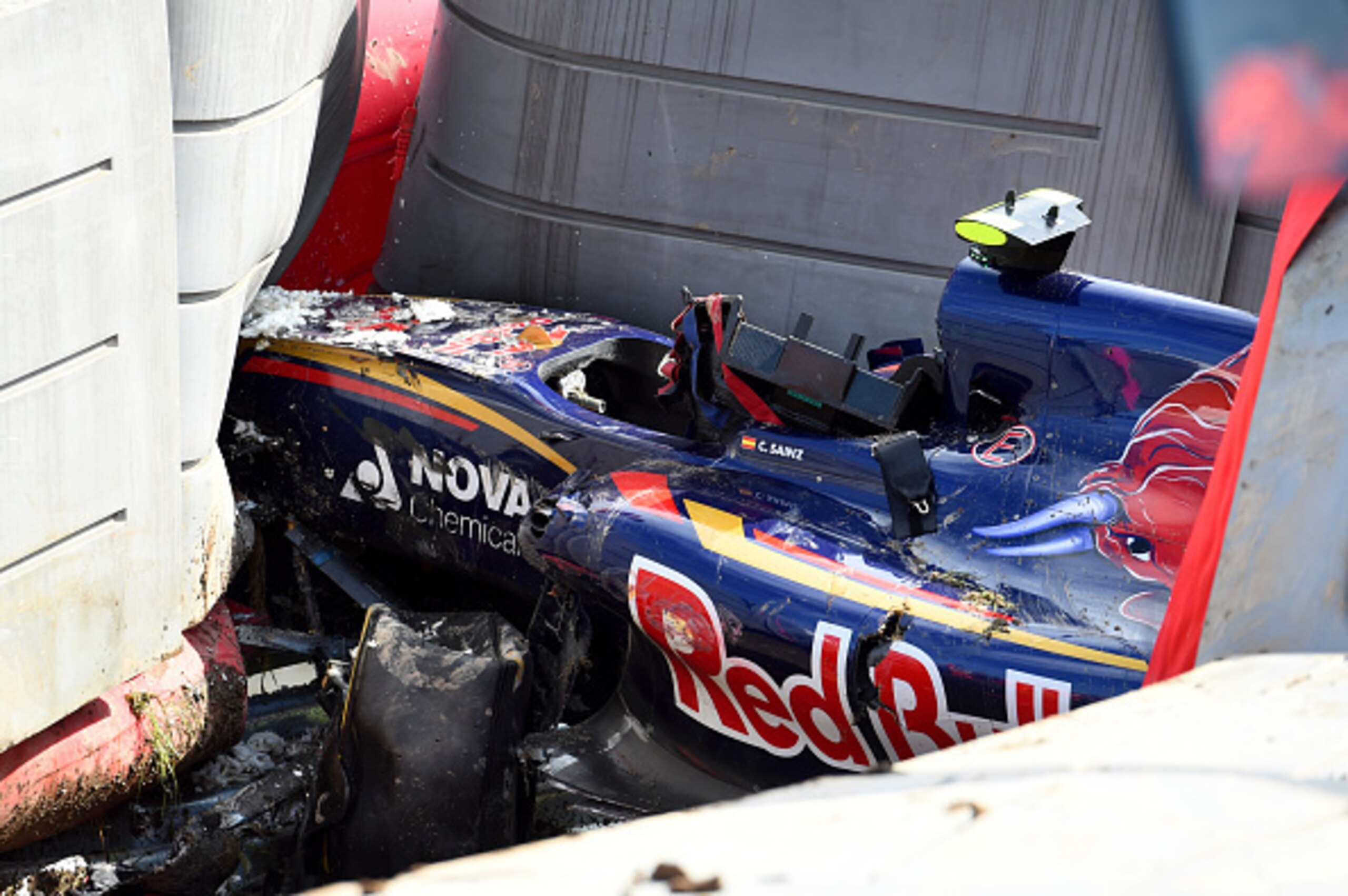 Carlos Sainz Jr.'s Toro Rosso buried in the barriers after a huge shunt. He raced the following day.