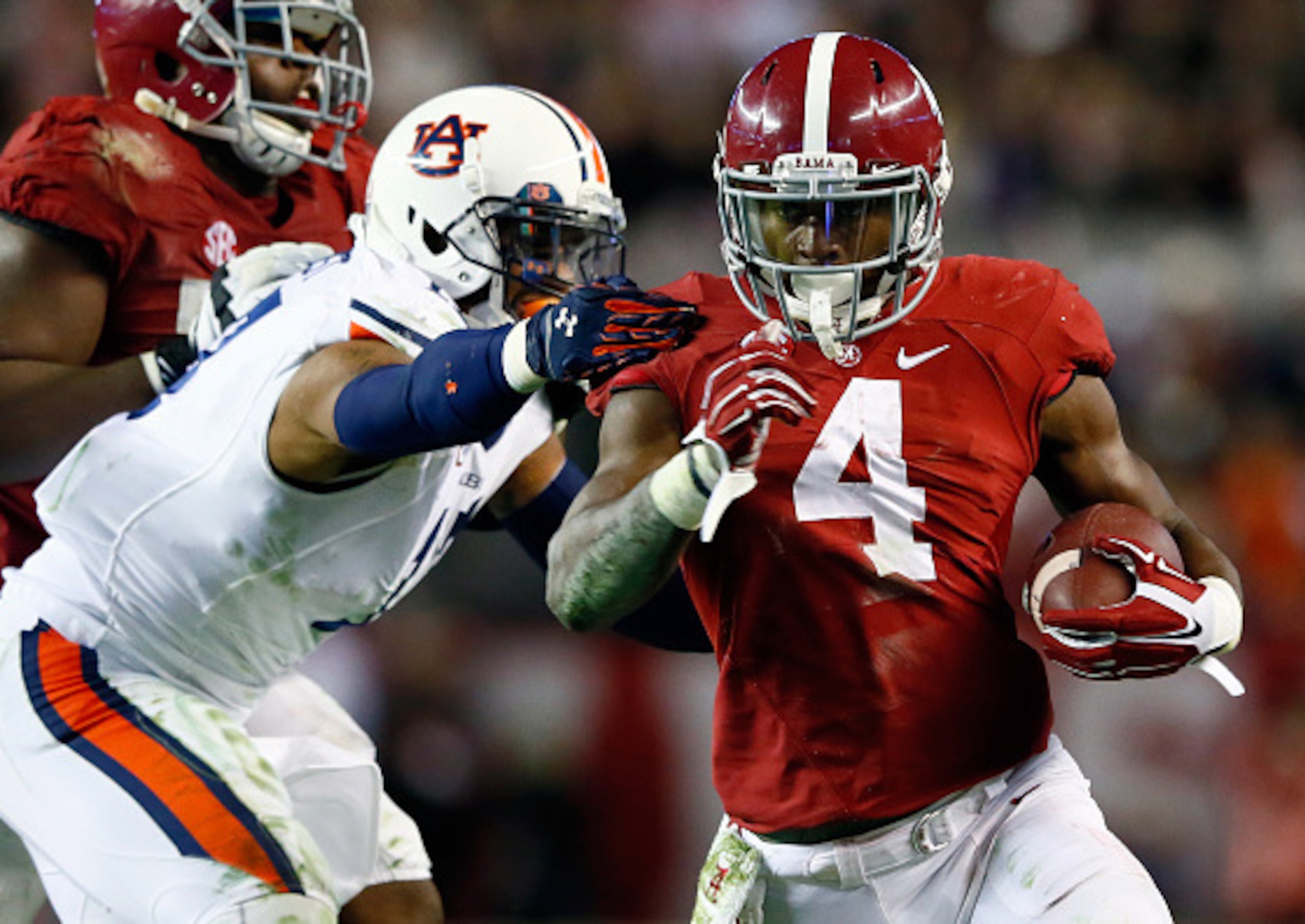 TUSCALOOSA, AL - NOVEMBER 29:  T.J. Yeldon #4 of the Alabama Crimson Tide runs the ball in the fourth quarter against the Auburn Tigers during the Iron Bowl at Bryant-Denny Stadium on November 29, 2014 in Tuscaloosa, Alabama.  (Photo by Kevin C. Cox/Getty