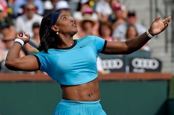 Serena Williams prepares to hit an overhead during a match at the 2016 BNP Paribas Open at Indian Wells.