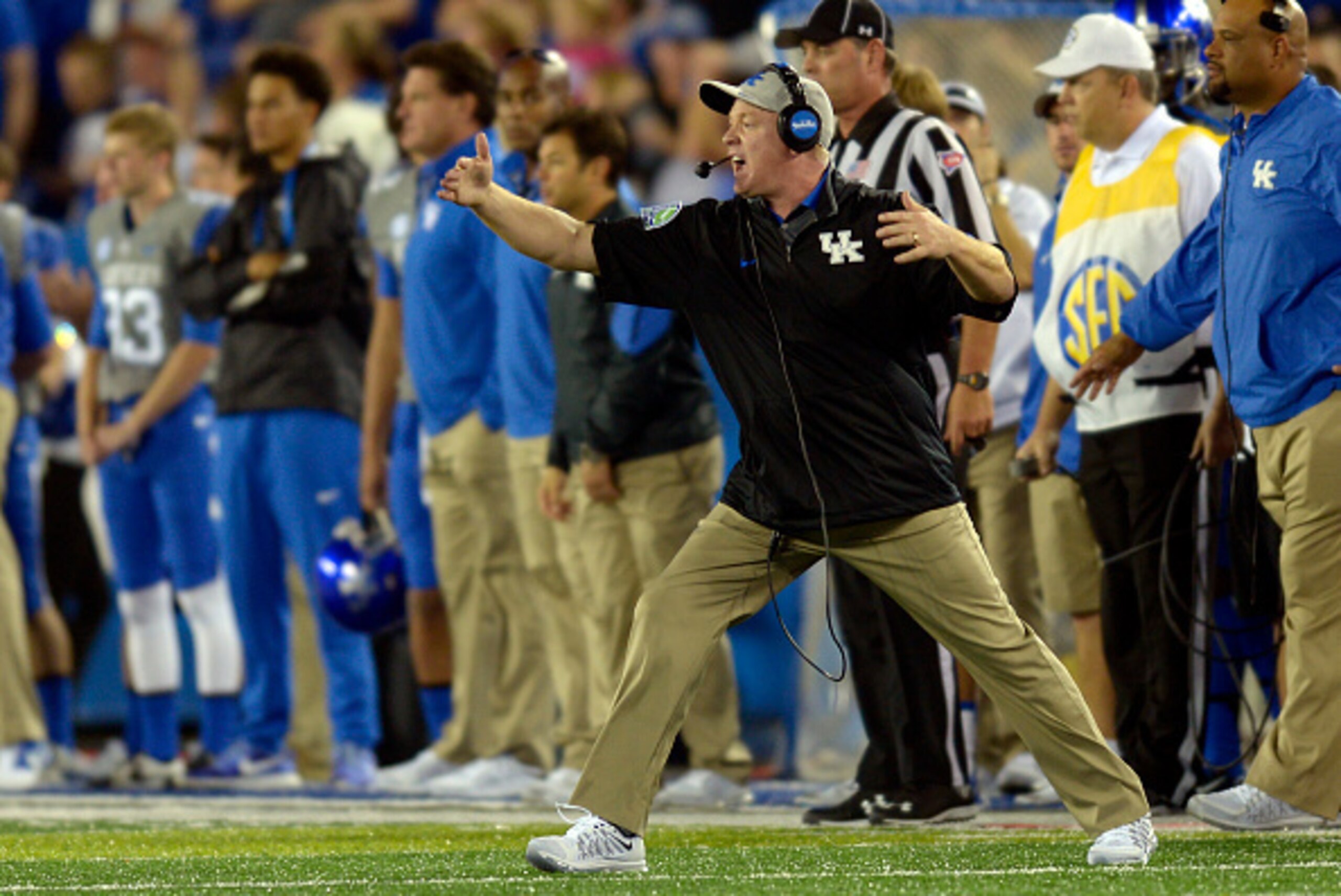 Kentucky's Mark Stoops has a long way to go before he can come close to being as popular as the school's basketball coach, John Calipari.