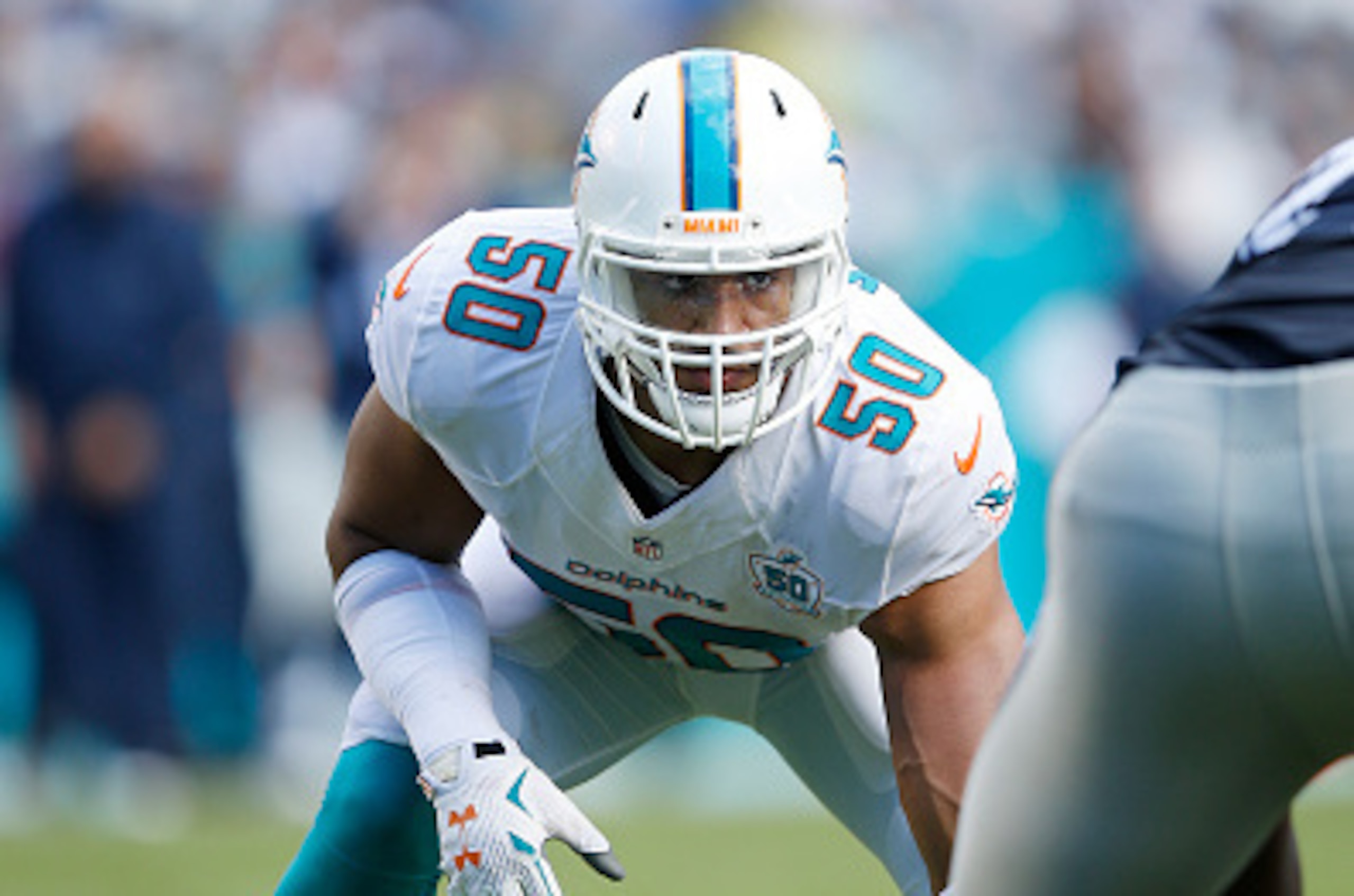 MIAMI GARDENS, FL - NOVEMBER 22: Olivier Vernon #50 of the Miami Dolphins lines up against the Dallas Cowboys during the game at Sun Life Stadium on November 22, 2015 in Miami Gardens, Florida. Dallas defeated Miami 24-14. (Photo by Joe Robbins/Getty Imag