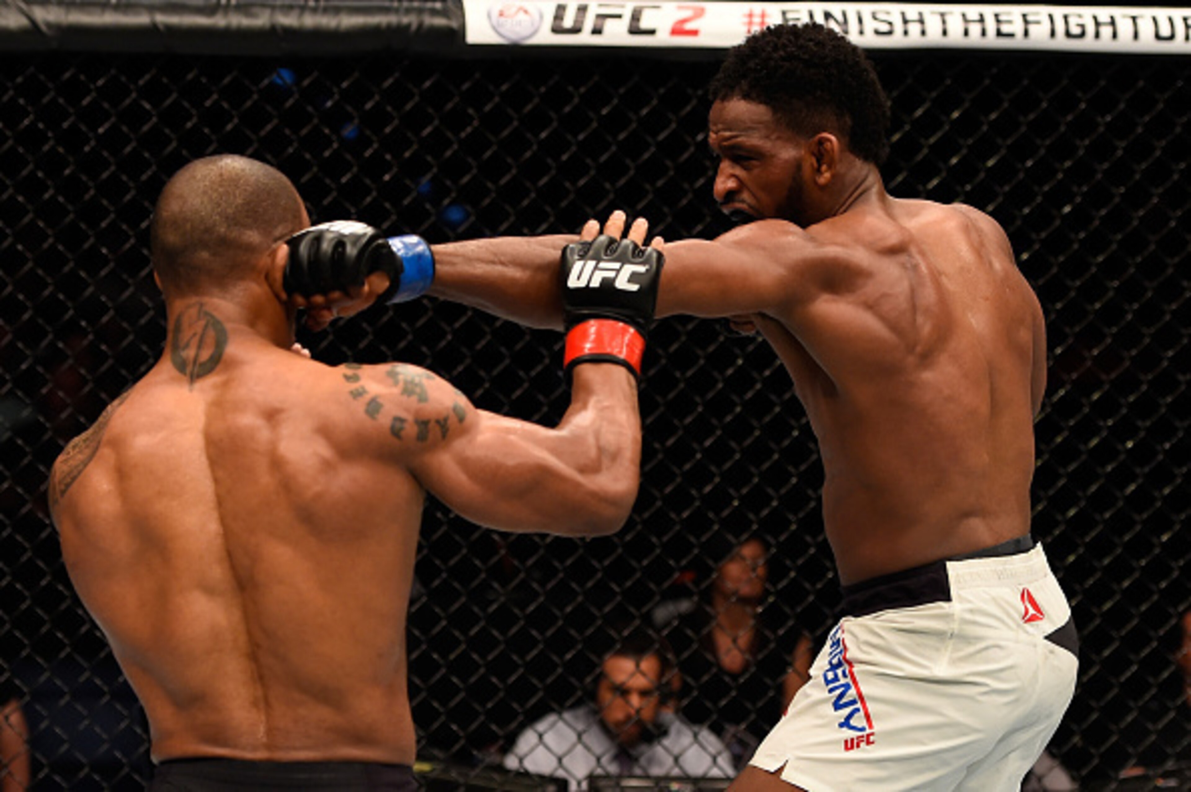 Neil Magny (right) jabs Hector Lombard