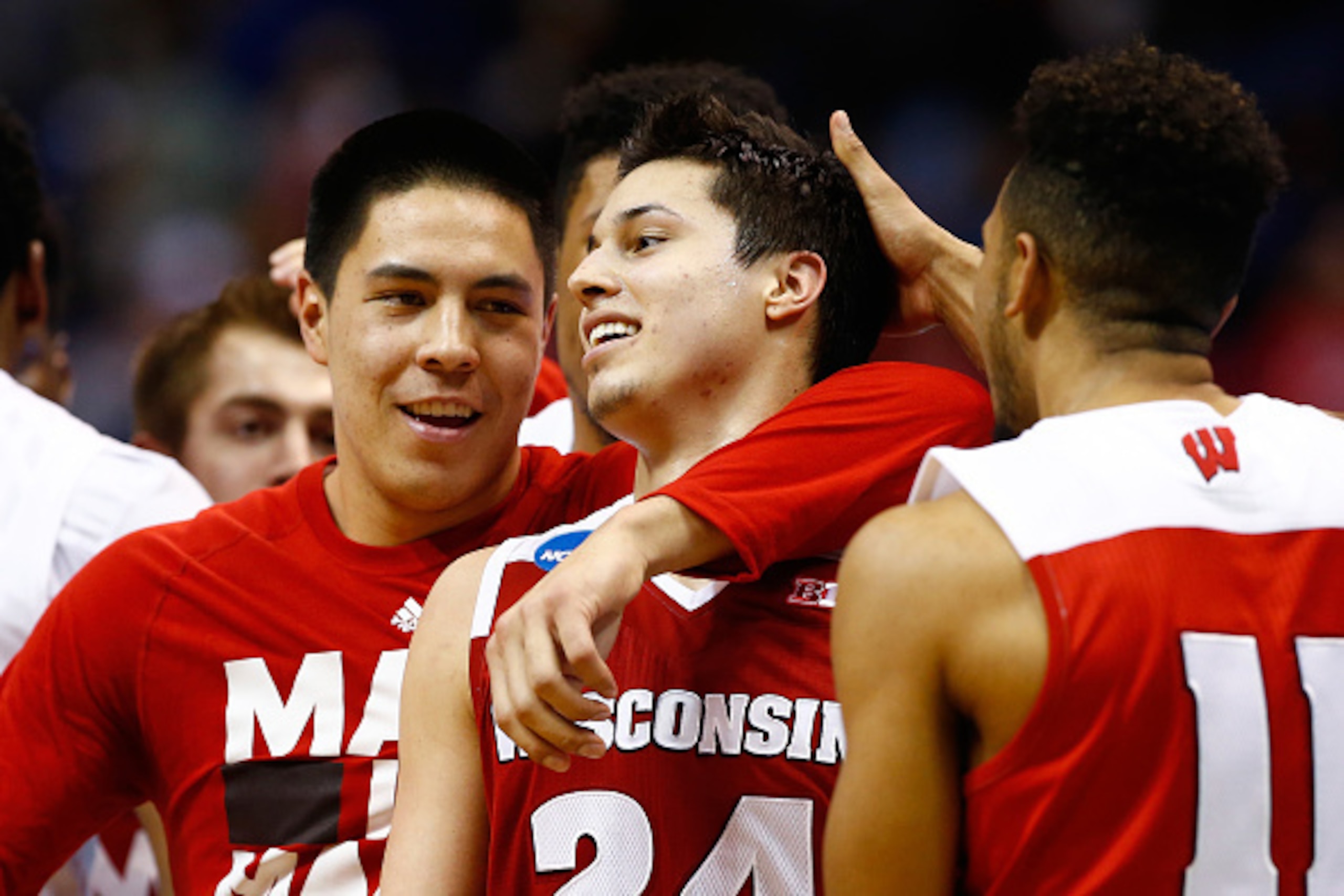 Bronson Koenig (center) celebrates with Wisconsin teammates after upsetting Xavier.
