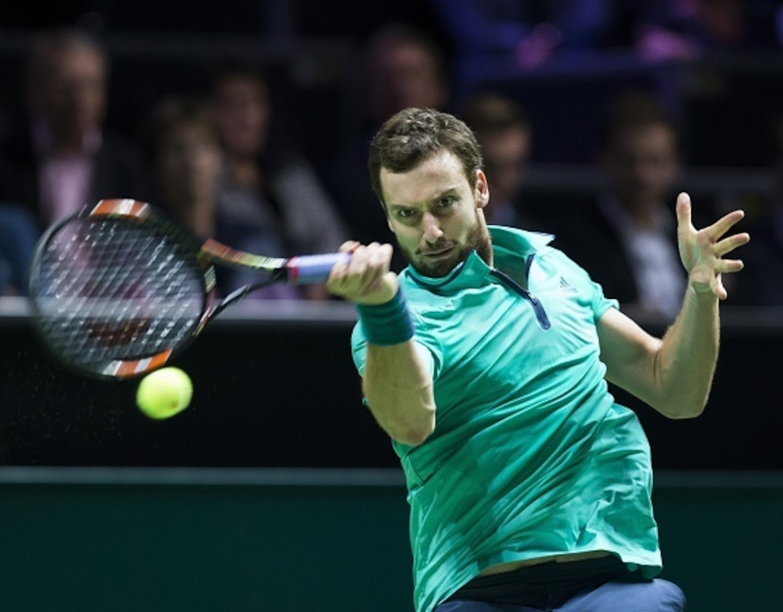 Latvias Ernests Gulbis returns the ball to French Gael Monfils during their first round match of the ABN AMRO World Tennis Tournament in Rotterdam, on February 9, 2016.  / AFP / ANP / Koen Suyk / Netherlands OUT        (Photo credit should read KOEN SUYK/