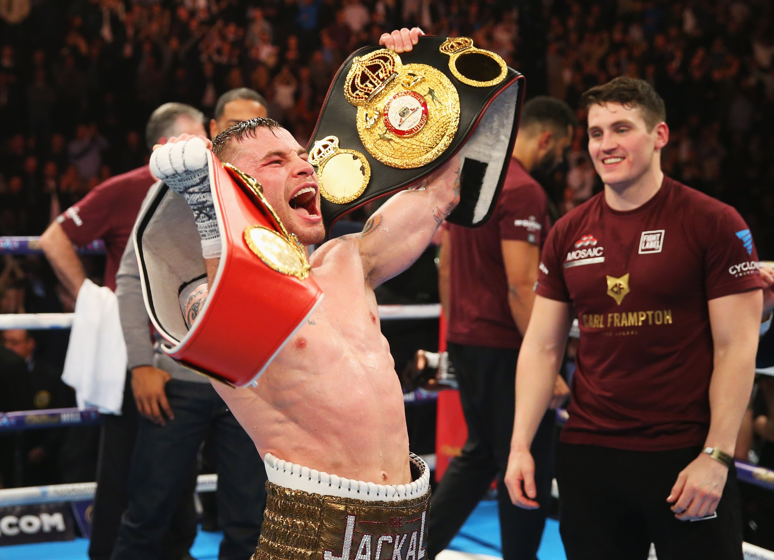 Carl Frampton celebrates after winning his unification bout with Scott Quigg.