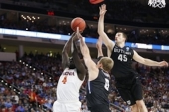 Andrew Chrabascz goes for a block.