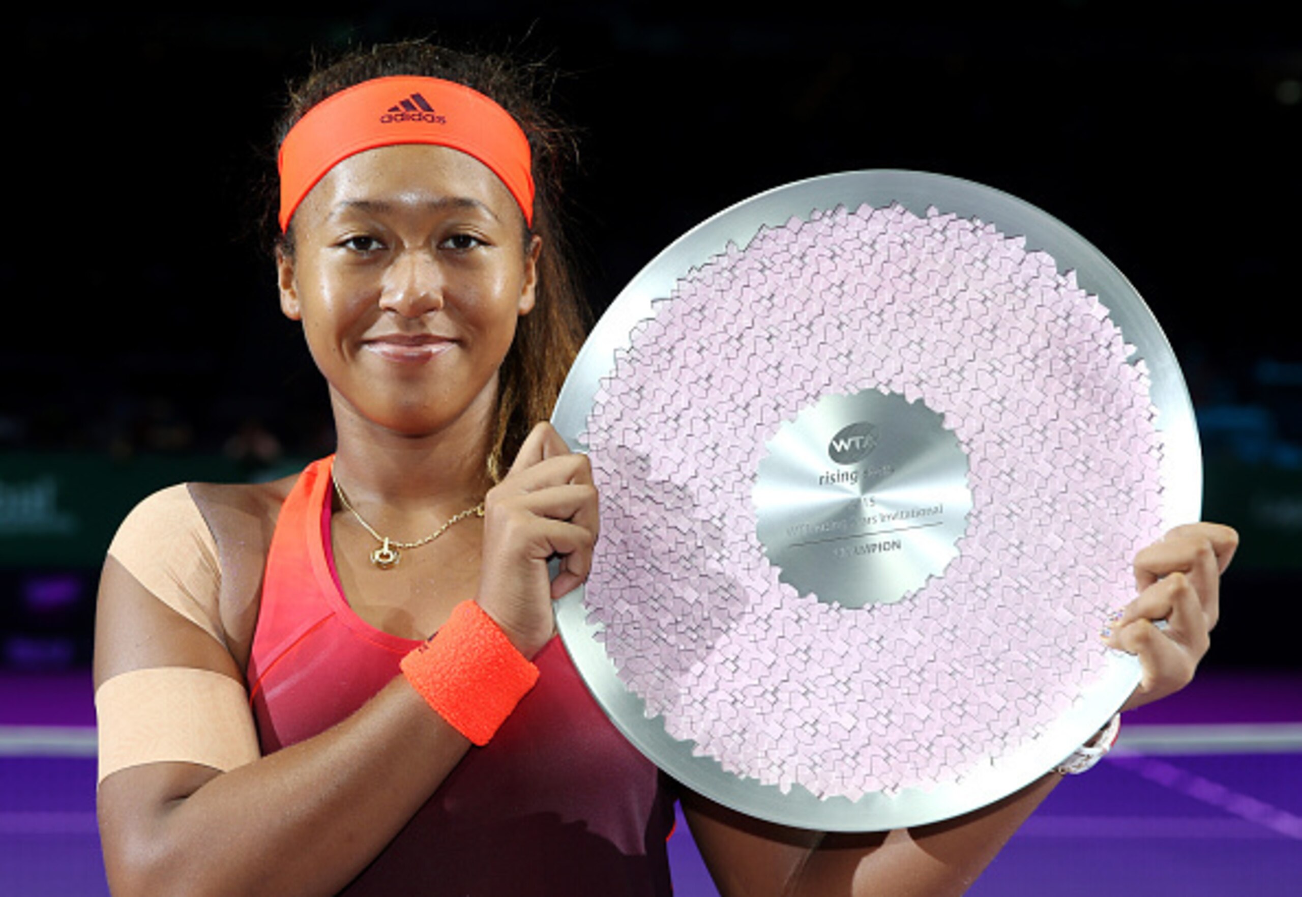 Naomi Osaka celebrates winning the 2015 WTA Tour Rising Stars Invitational.