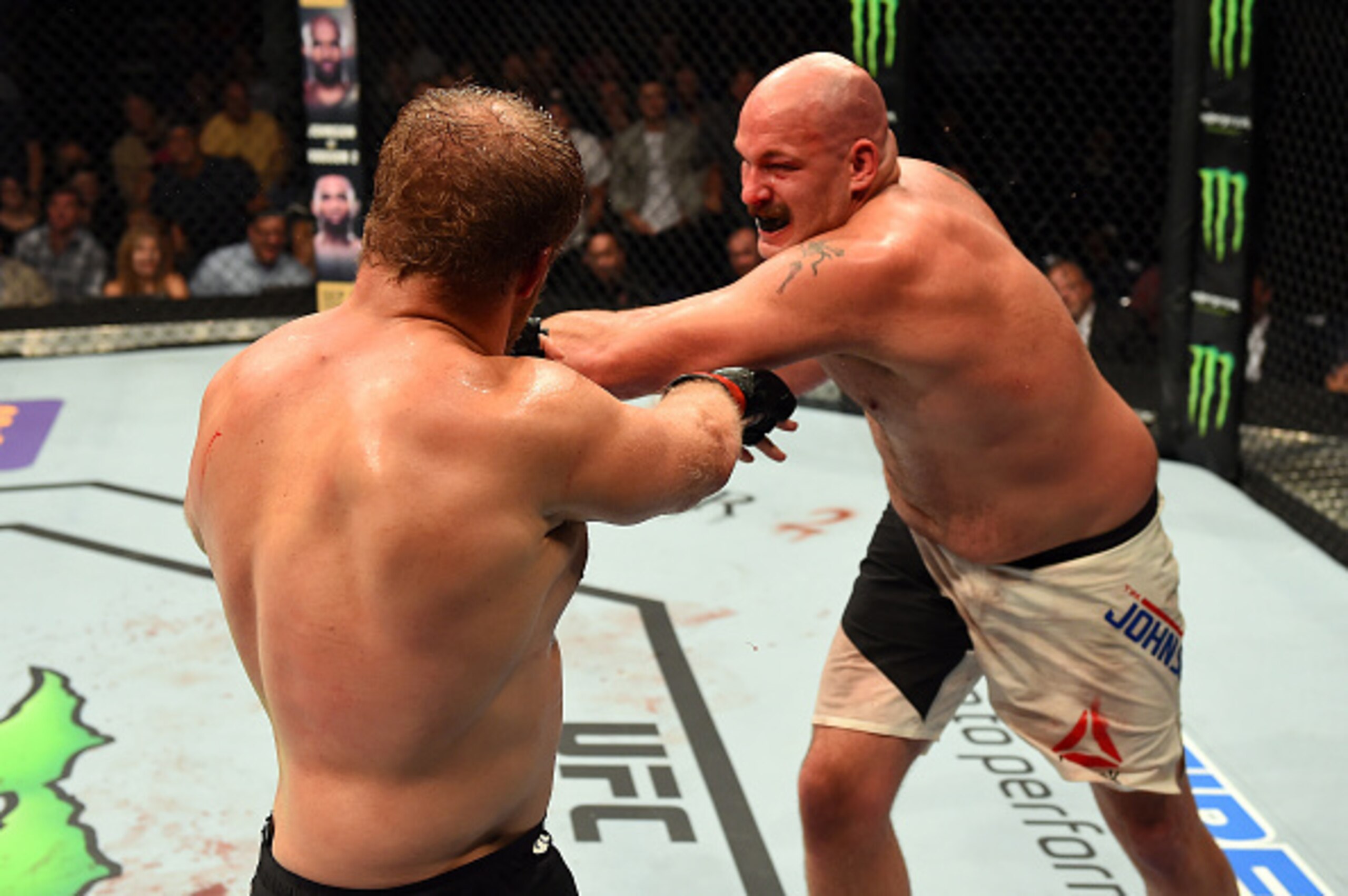 Timothy Johnson lands a left against Jared Rosholt