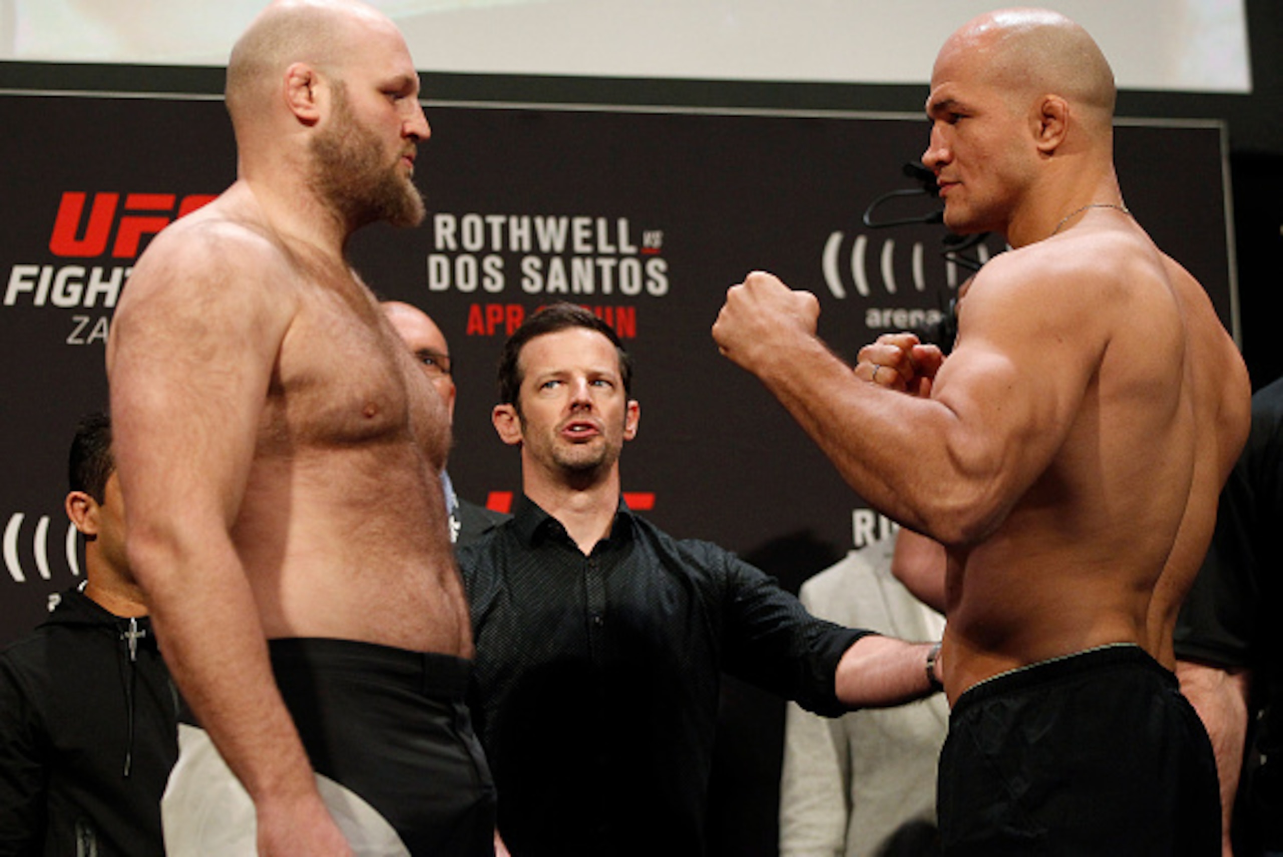 Ben Rothwell (left) and Junior dos Santos face off before their fight on Sunday.