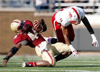 Juston Burris (right) was a physical cornerback in his time at NC State.