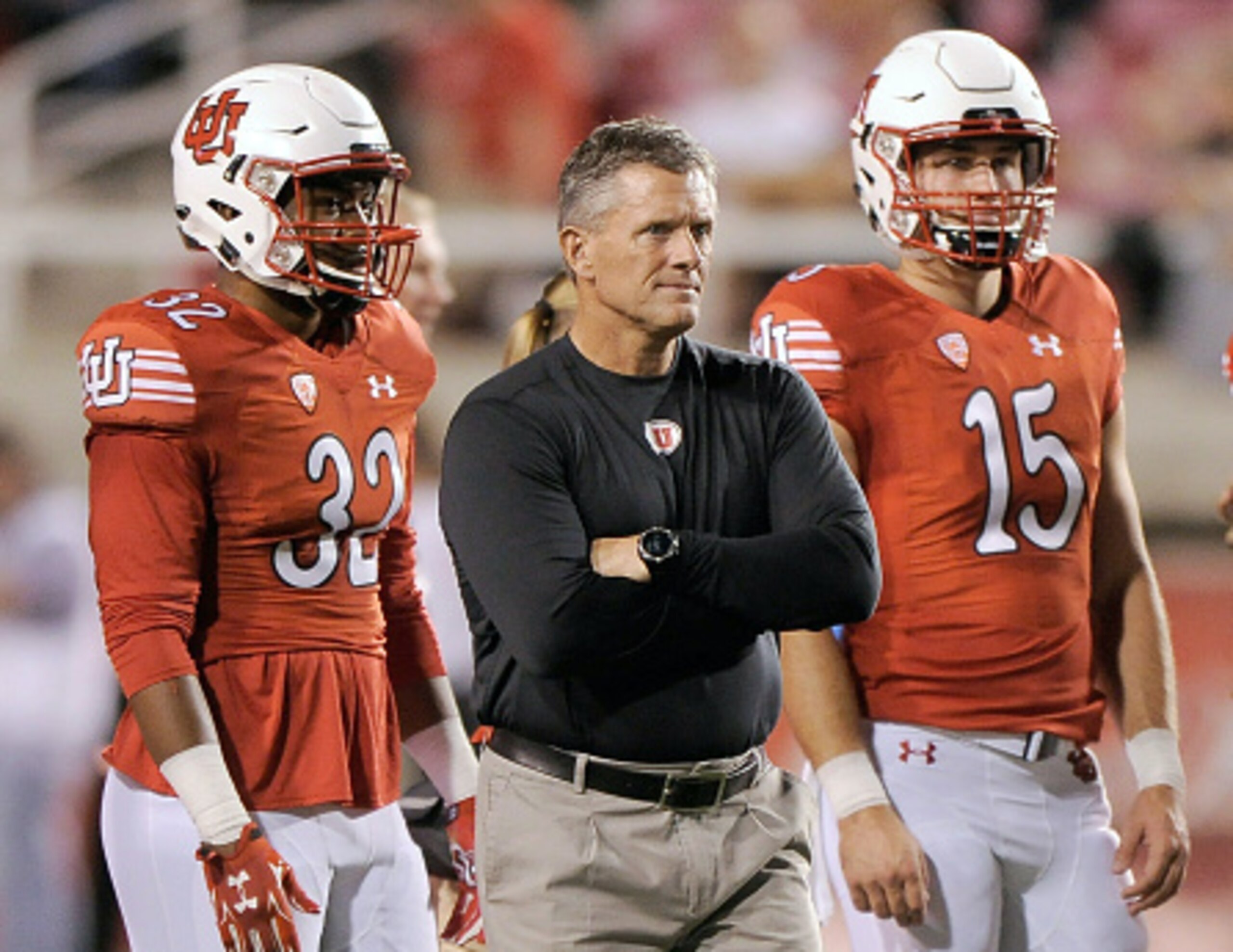 Utah head coach Kyle Whittingham (center)