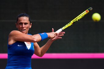 Roberta Vinci hits a backhand during Fed Cup play.