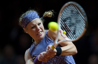 Laura Siegemund hits a backhand at the 2016 Porsche Grand Prix in Stuttgart.