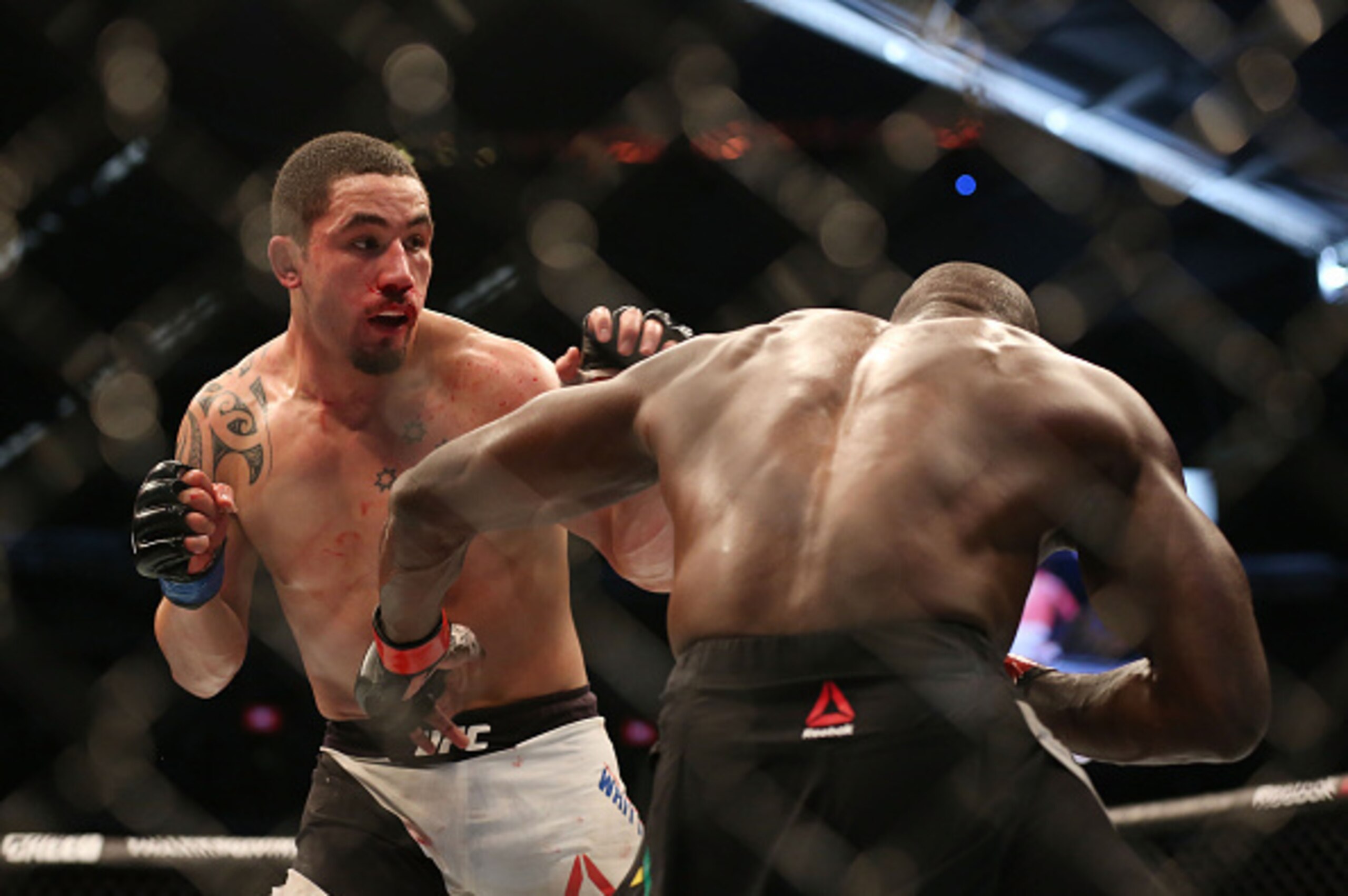 Robert Whittaker, left, and Uriah Hall Robert Whittaker, left, and Uriah Hall