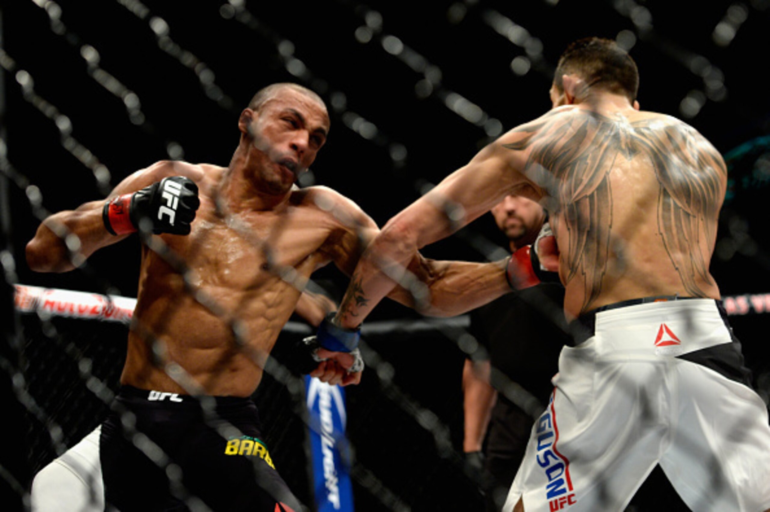 Edson Barboza punches Tony Ferguson. Edson Barboza punches Tony Ferguson.