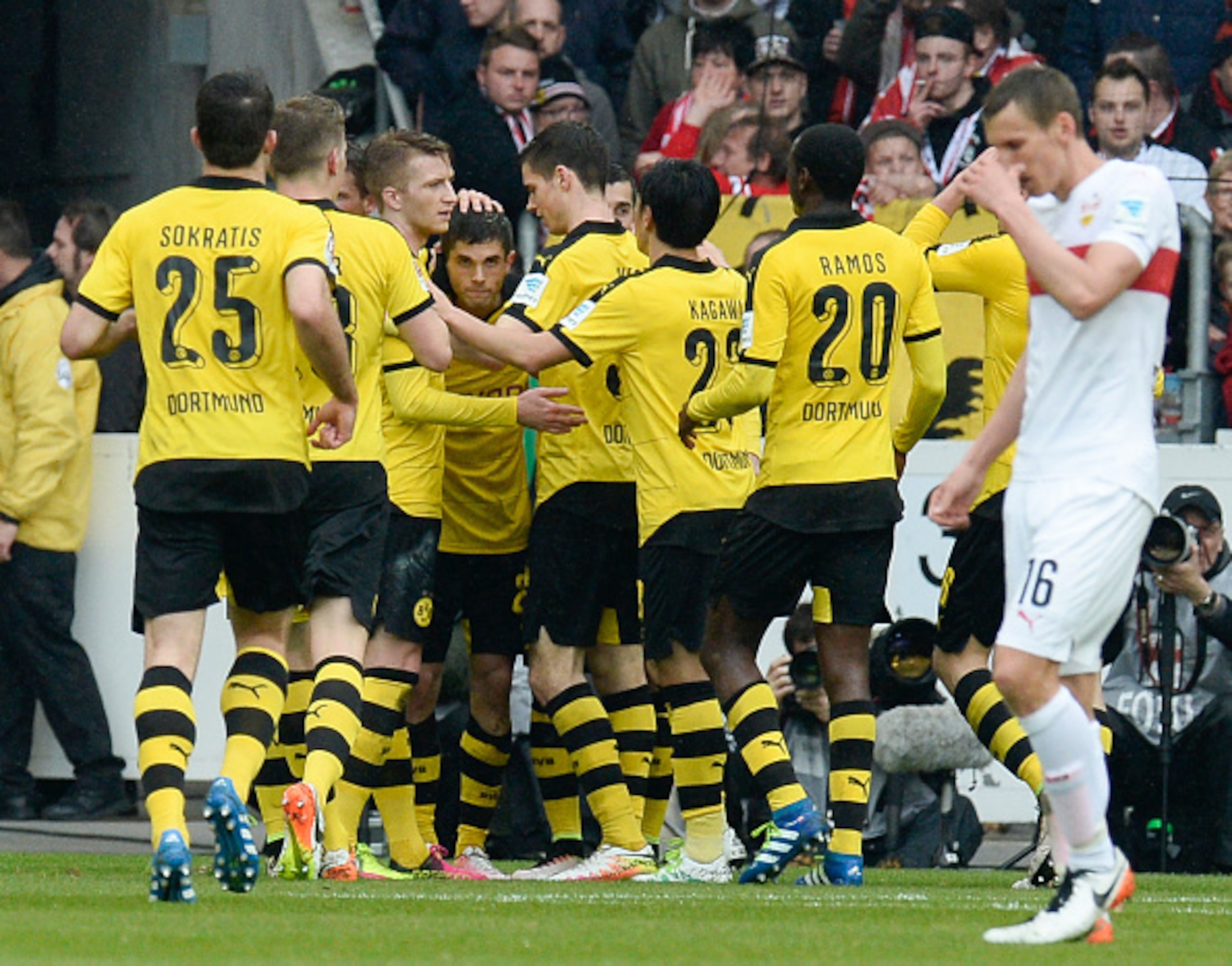 He's in there somewhere: team-mates celebrating Pulisic's goal.