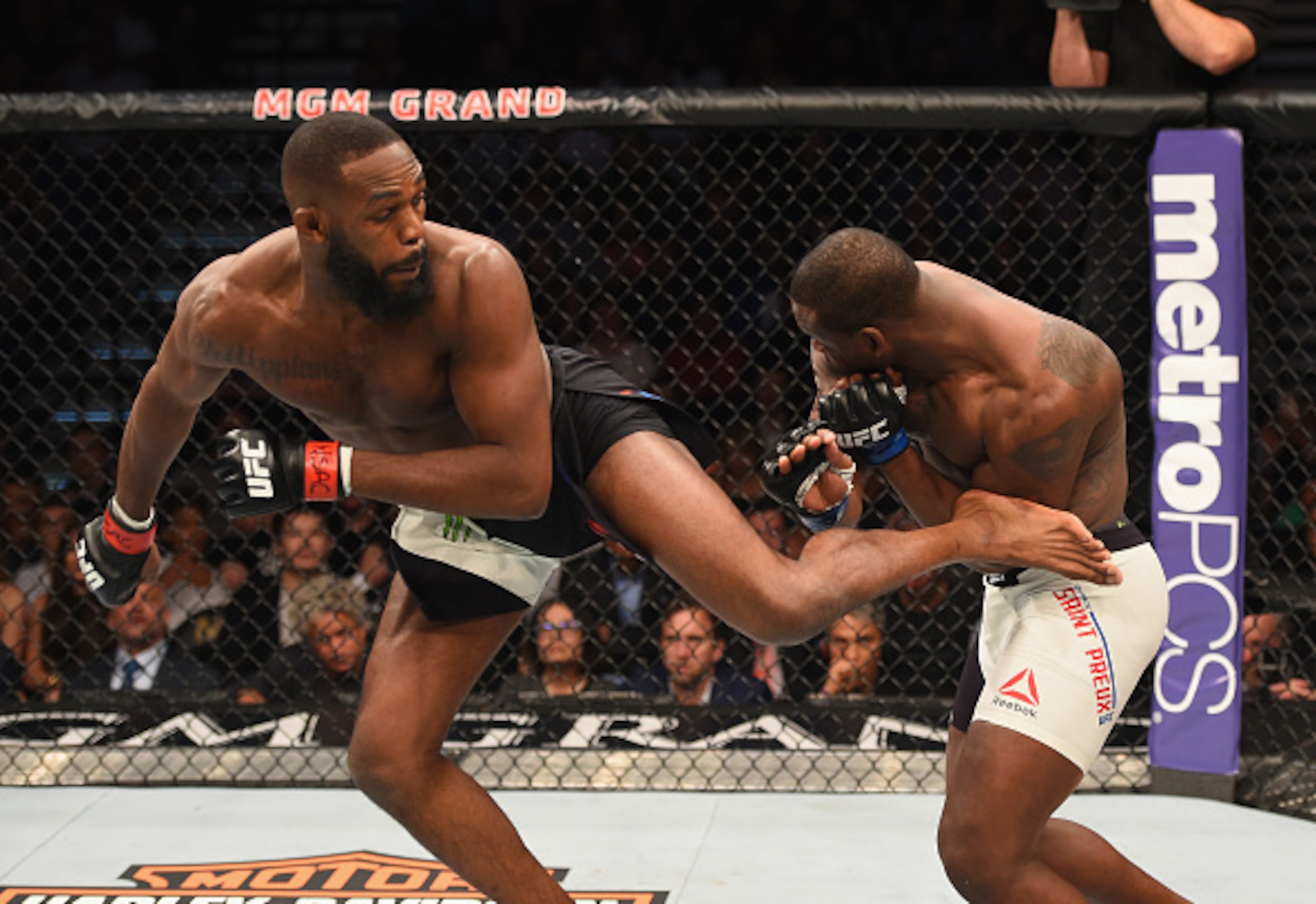 Jon Jones (left) hits a spinning back kick on Ovince Saint Preux.