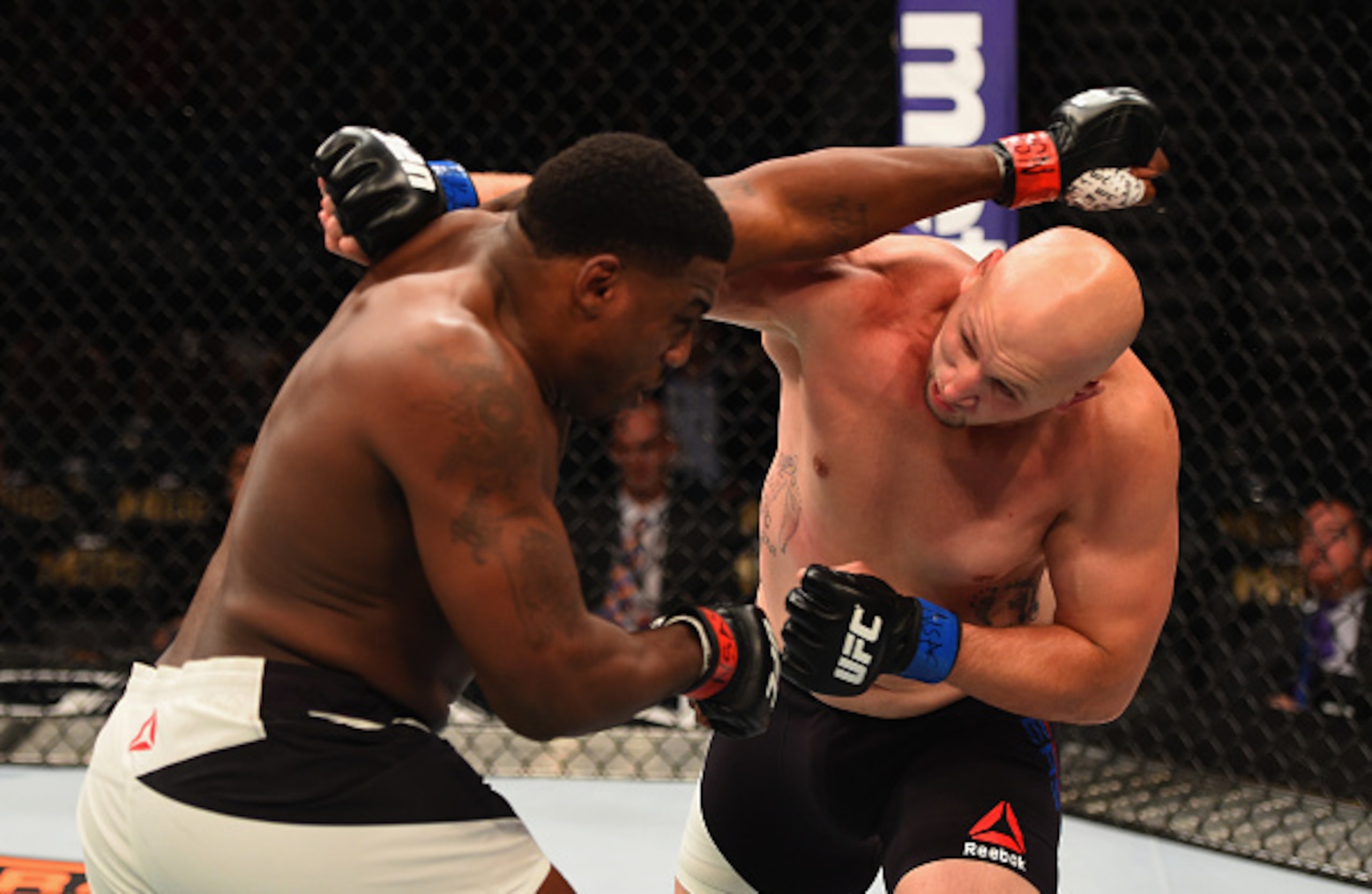 Walt Harris (left) exchanges with Cody East