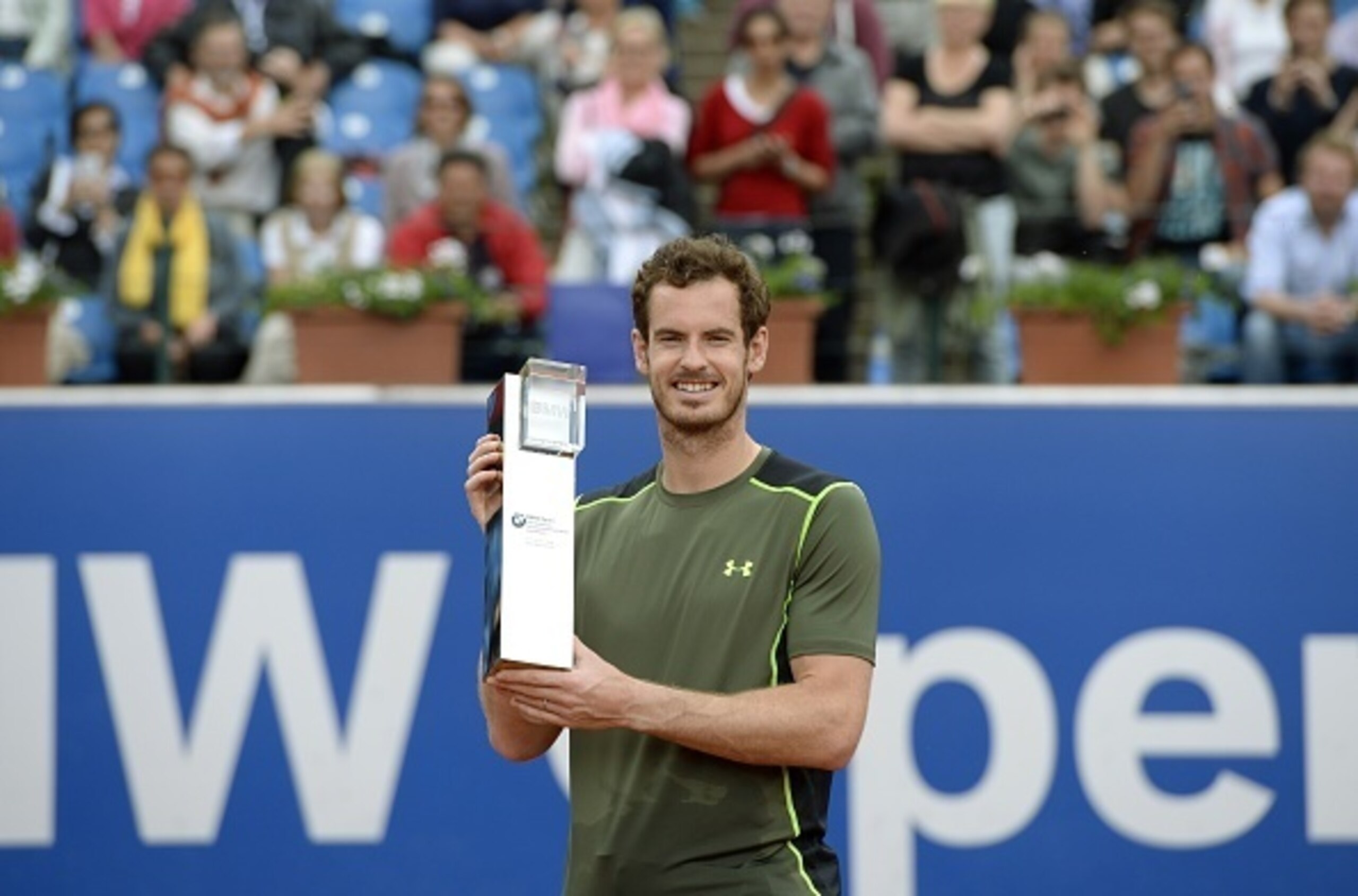 Britain's Andy Murray poses with the trophy during the award ceremony after his final match against Germany's Philipp Kohlschreiber during the ATP Tennis BMW Open in Munich, southern Germany, on May 4, 2015. Murray won the match 7-6, 5-7 and 7-6. AFP PHOT