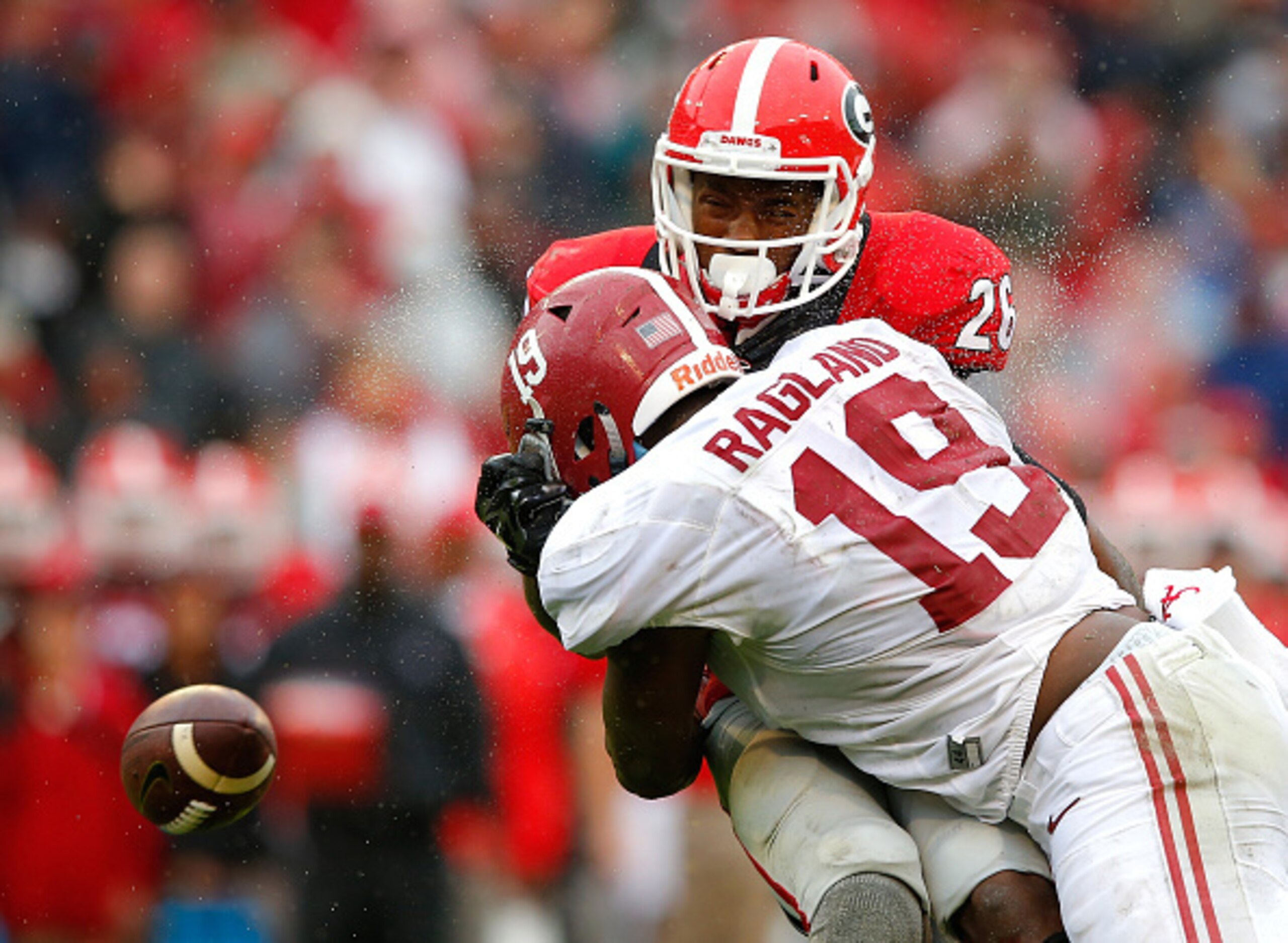 ATHENS, GA - OCTOBER 03:  Reggie Ragland #19 of the Alabama Crimson Tide breaks up a reception as he tackles Malcolm Mitchell #26 of the Georgia Bulldogs at Sanford Stadium on October 3, 2015 in Athens, Georgia.  (Photo by Kevin C. Cox/Getty Images)