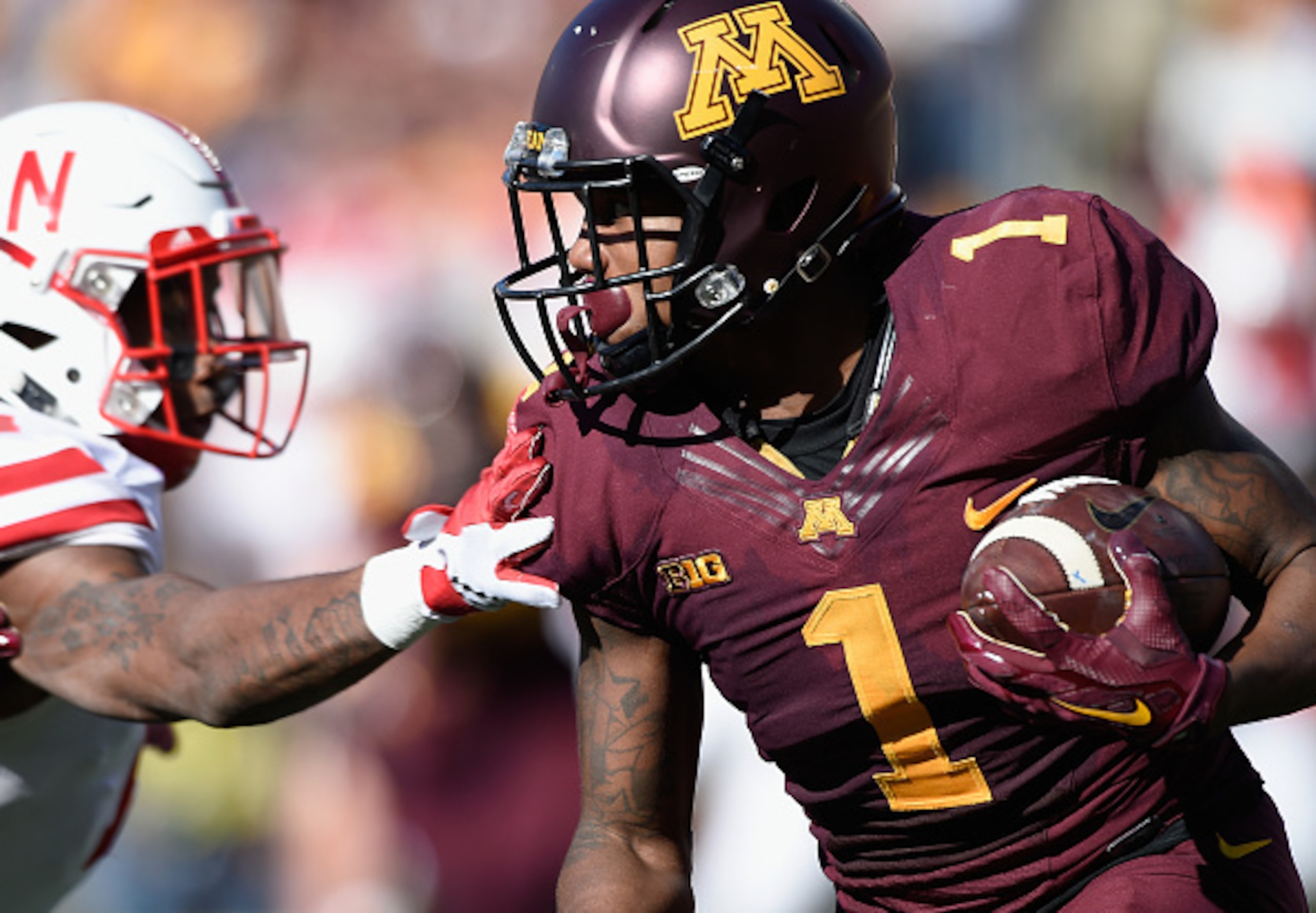 MINNEAPOLIS, MN - OCTOBER 17: KJ Maye #1 of the Minnesota Golden Gophers carries returns a punt against Jonathan Rose #14 of the Nebraska Cornhuskers during the first quarter of the game on October 17, 2015 at TCF Bank Stadium in Minneapolis, Minnesota. (