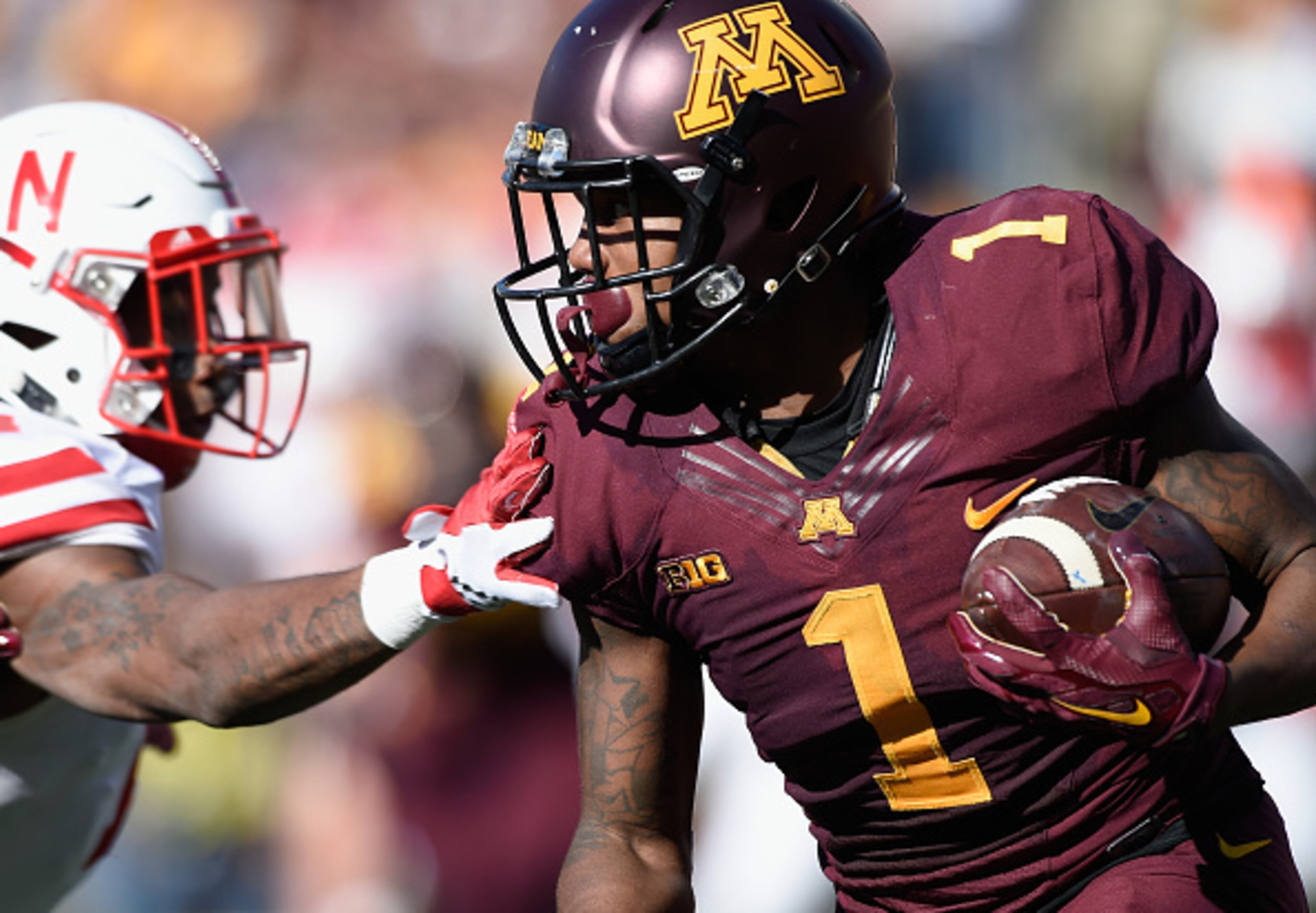 MINNEAPOLIS, MN - OCTOBER 17: KJ Maye #1 of the Minnesota Golden Gophers carries returns a punt against Jonathan Rose #14 of the Nebraska Cornhuskers during the first quarter of the game on October 17, 2015 at TCF Bank Stadium in Minneapolis, Minnesota. (
