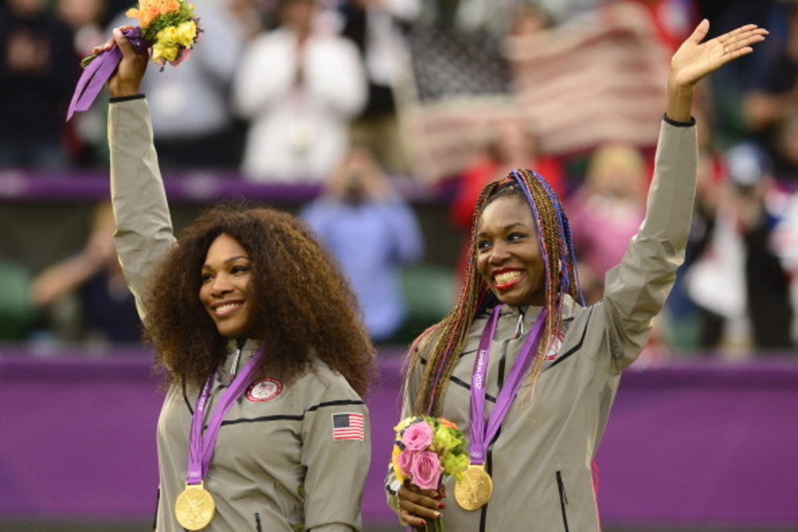 Serena and Venus Williams celebrate winning the gold medal in women's doubles at the 2012 Olympics in London. Serena and Venus Williams celebrate winning the gold medal in women's doubles at the 2012 Olympics in London.