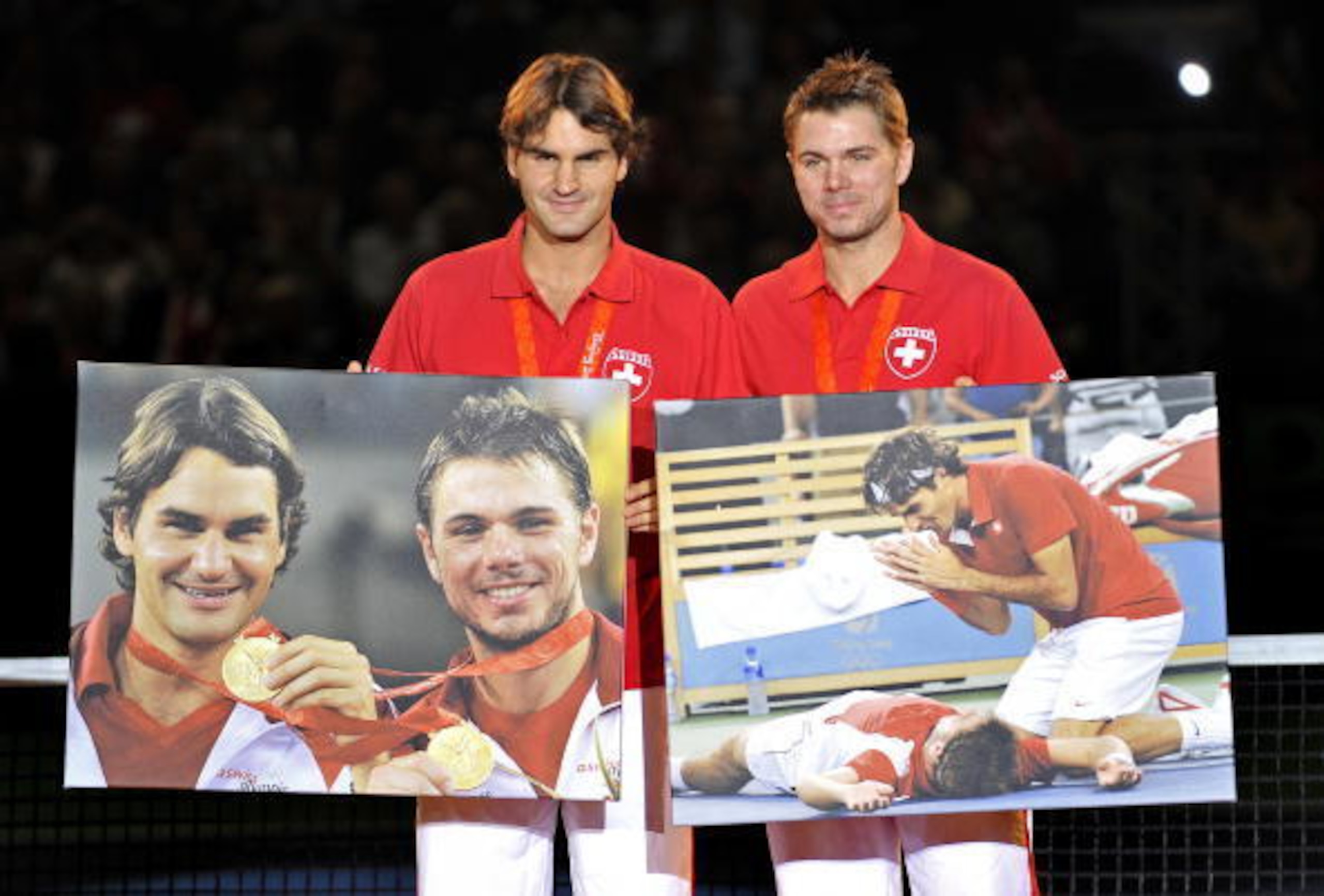 Roger Federer and Stan Wawrinka pose with photos of their gold medal in doubles at the 2008 Olympics. Roger Federer and Stan Wawrinka pose with photos of their gold medal in doubles at the 2008 Olympics.