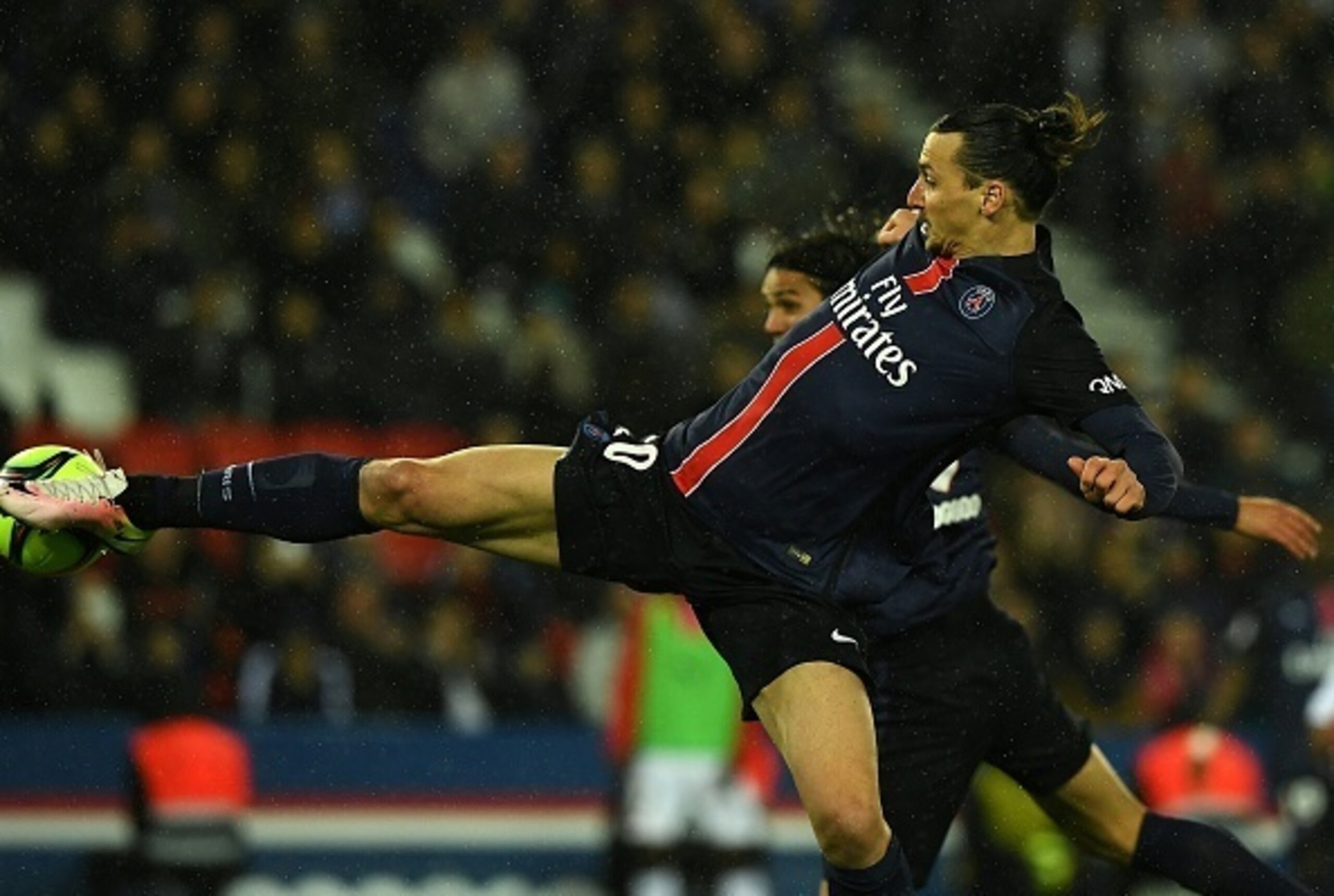 Paris Saint-Germain's Swedish forward Zlatan Ibrahimovic scores a goal  during the French L1 football match between Paris Saint-Germain and Rennes at the Parc des Princes stadium in Paris on April 30, 2016.  / AFP / FRANCK FIFE        (Photo credit should