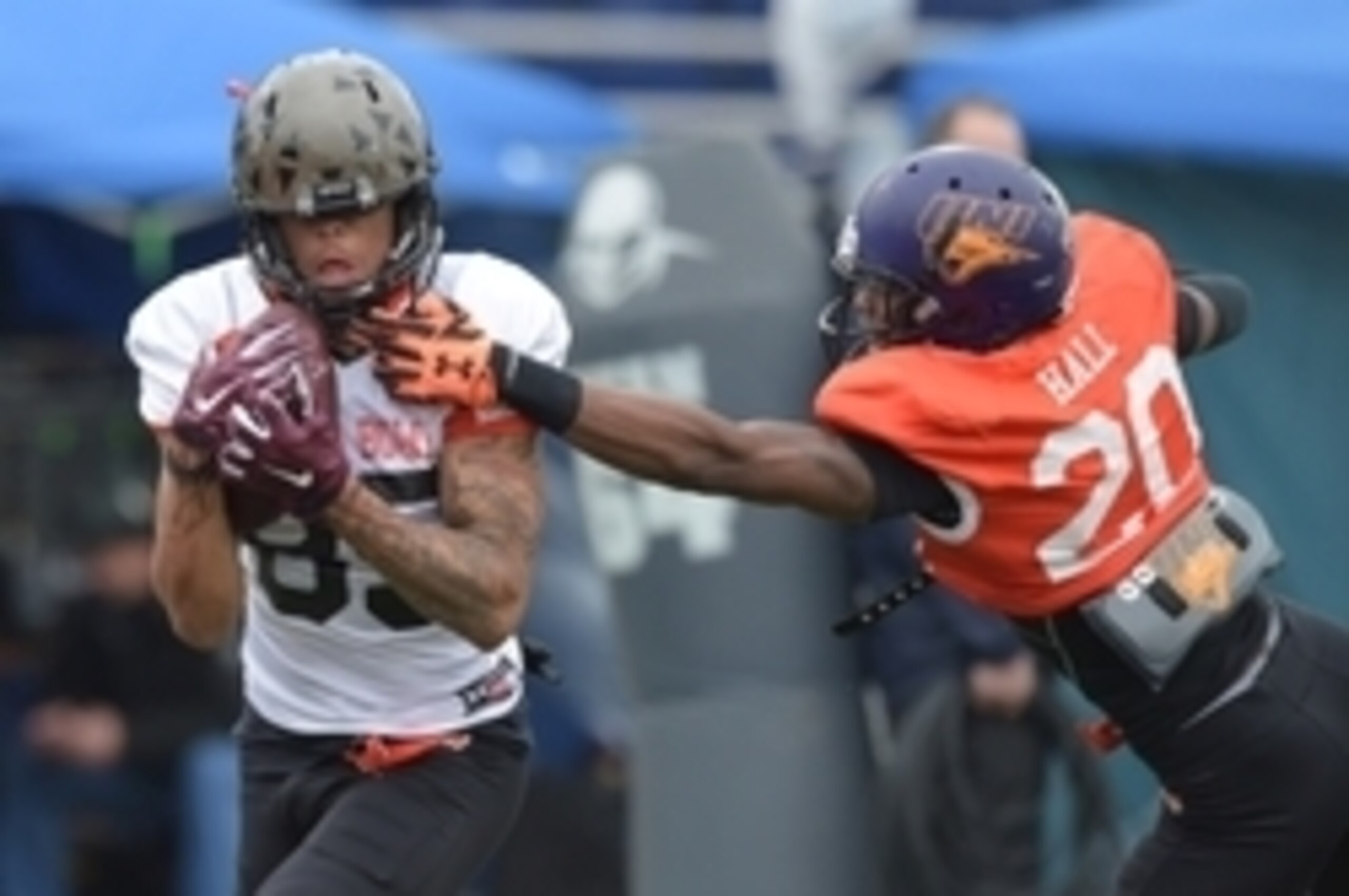 Jan 27, 2016; Mobile, AL, USA; North squad wide receiver Chris Moore of Cincinnati (85) catches a pass as defensive back Deiondre' Hall of Northern Iowa (20) defends during Senior Bowl practice at Ladd-Peebles Stadium. Mandatory Credit: Glenn Andrews-USA Jan 27, 2016; Mobile, AL, USA; North squad wide receiver Chris Moore of Cincinnati (85) catches a pass as defensive back Deiondre' Hall of Northern Iowa (20) defends during Senior Bowl practice at Ladd-Peebles Stadium. Mandatory Credit: Glenn Andrews-USA