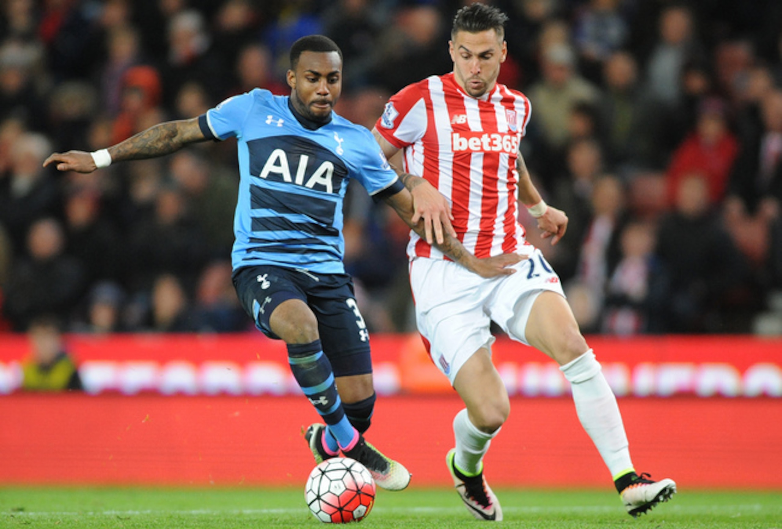Danny Rose bringing the ball forward for Tottenham against Stoke City.
